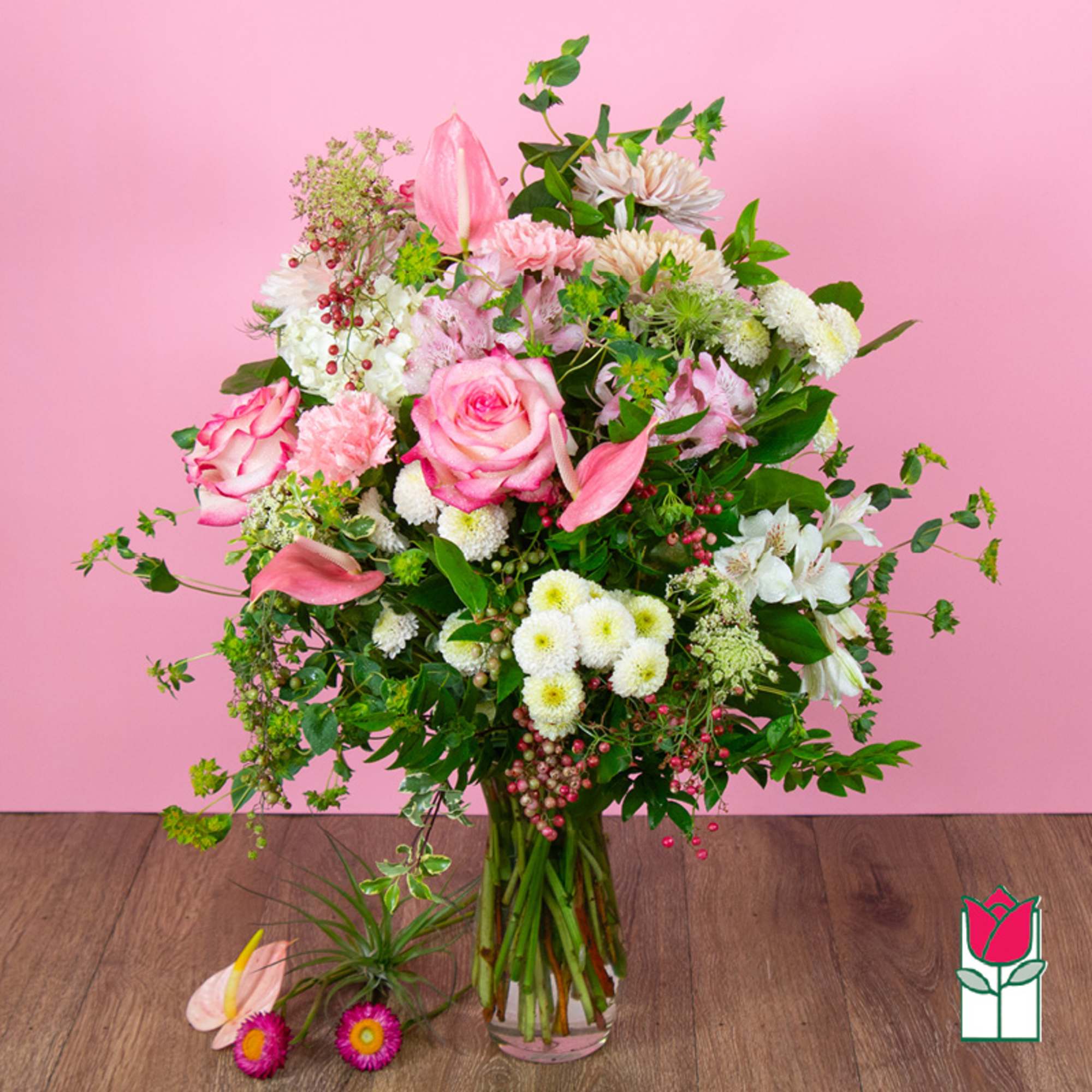 Pink and white mixed bouquet in a clear glass vase
