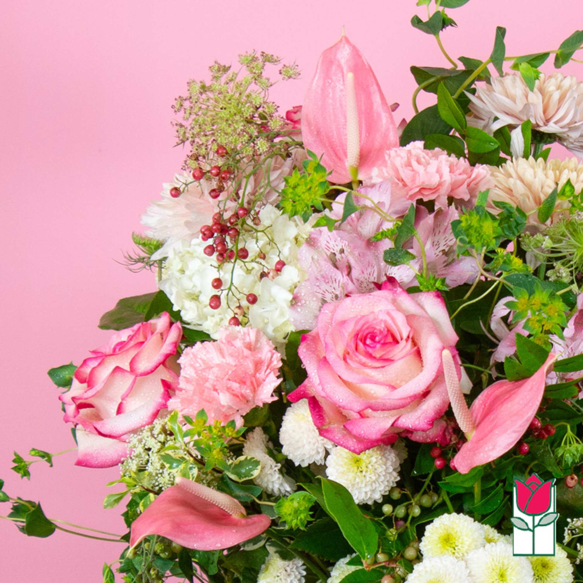 Pink and white mixed bouquet with roses and lilies on a pink background