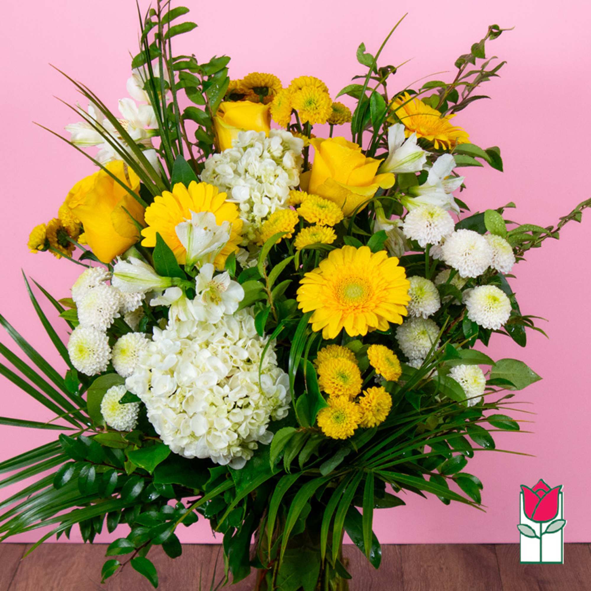 Yellow and white floral arrangement in a vase