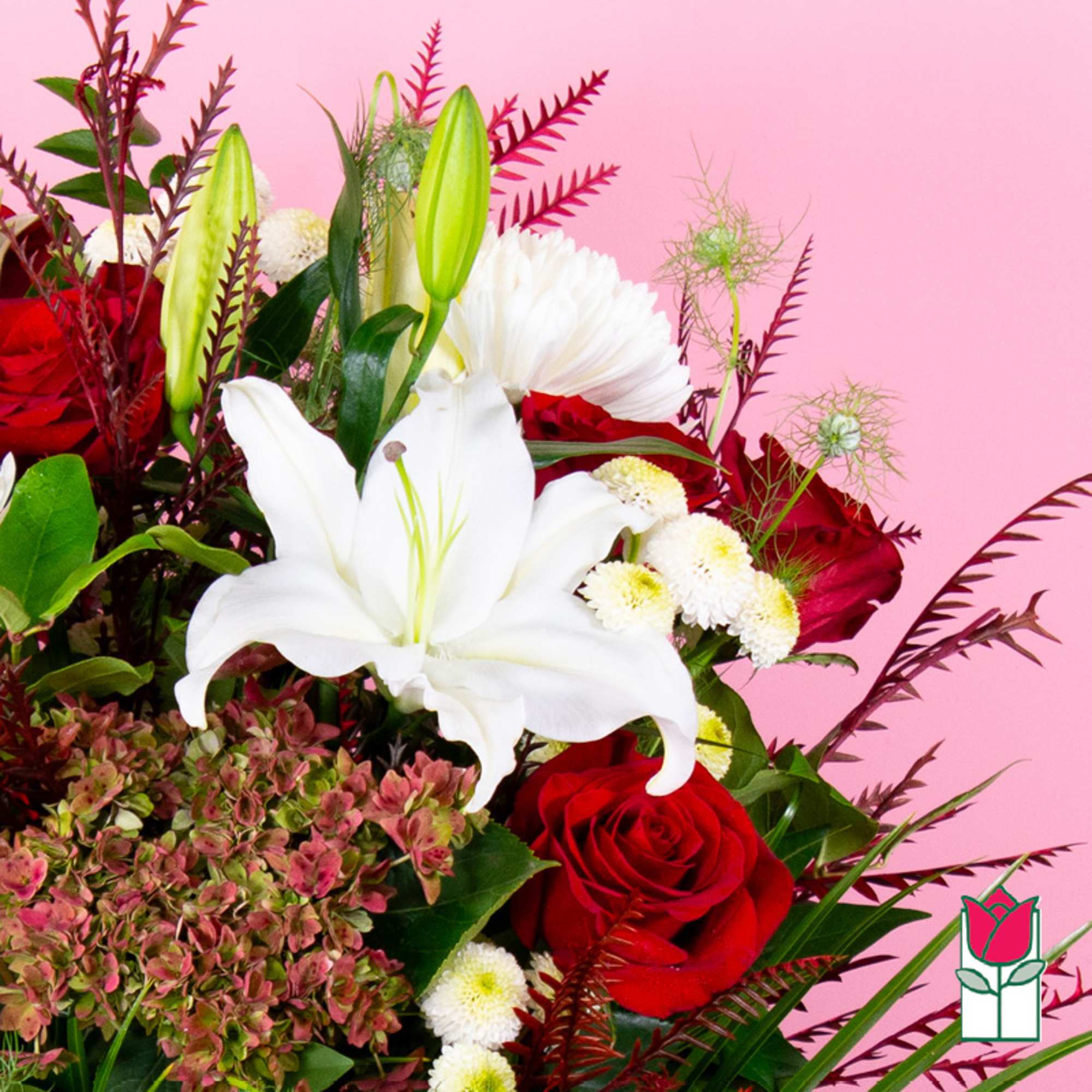 Bouquet with white lilies, red roses, and small white pom flowers