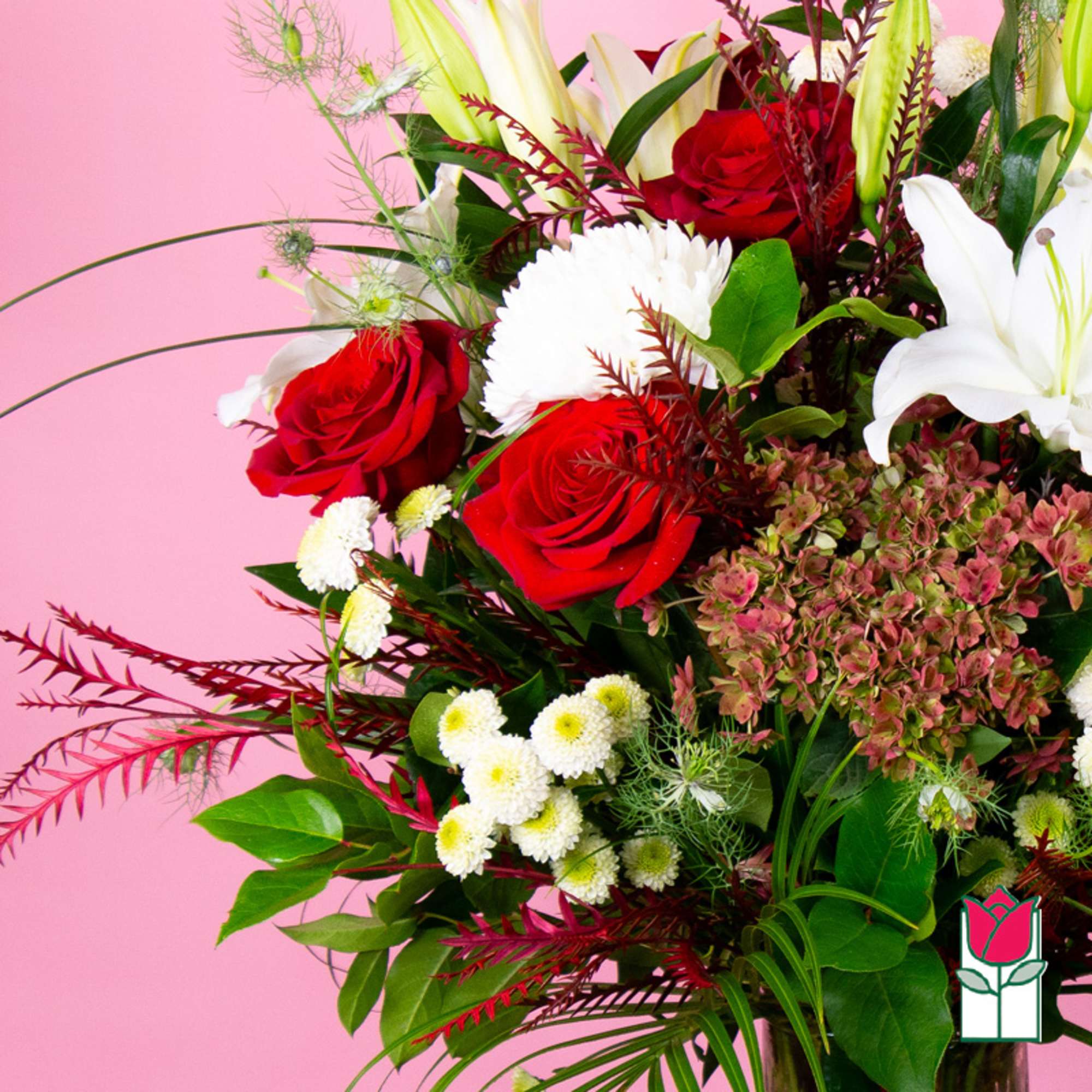 Bouquet of red roses and white lilies with mixed filler flowers