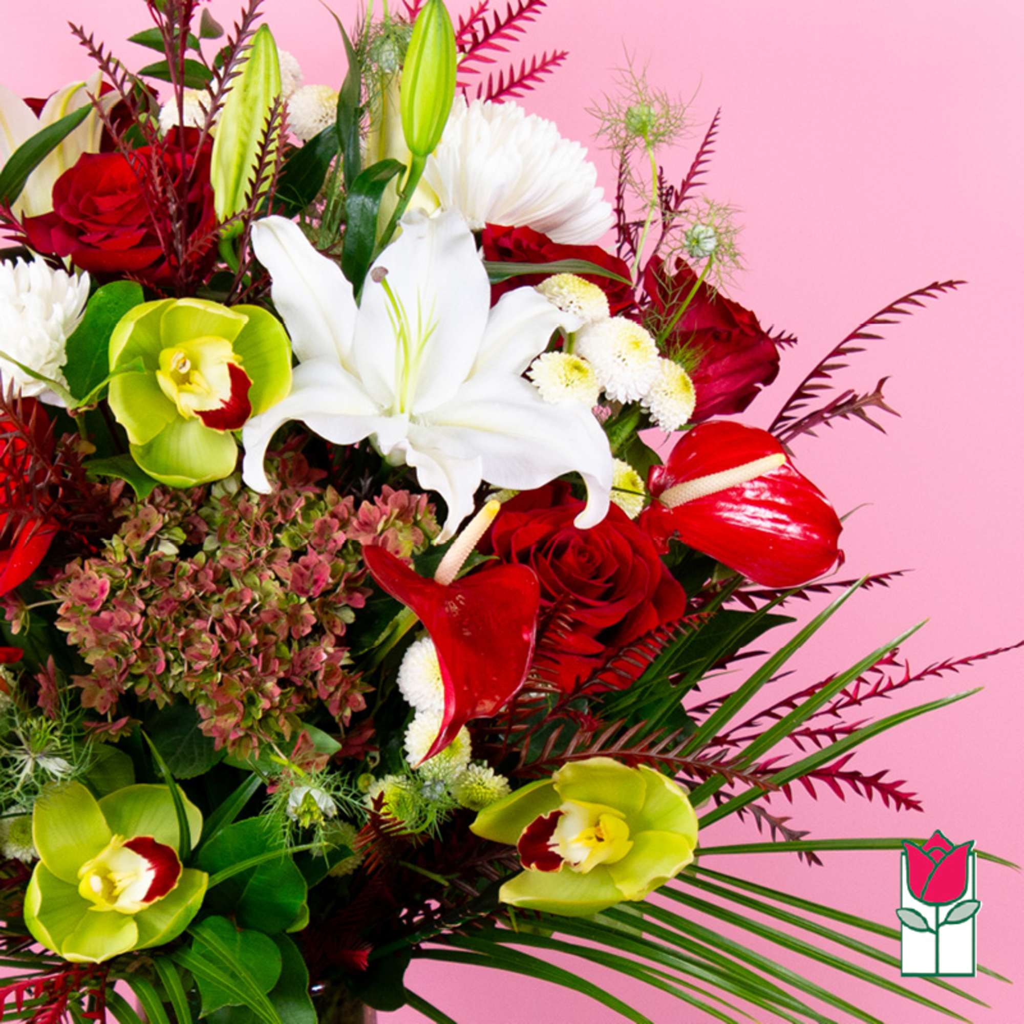 Bouquet of red roses, white lilies, and green orchids on a pink background, photo 3 of 4