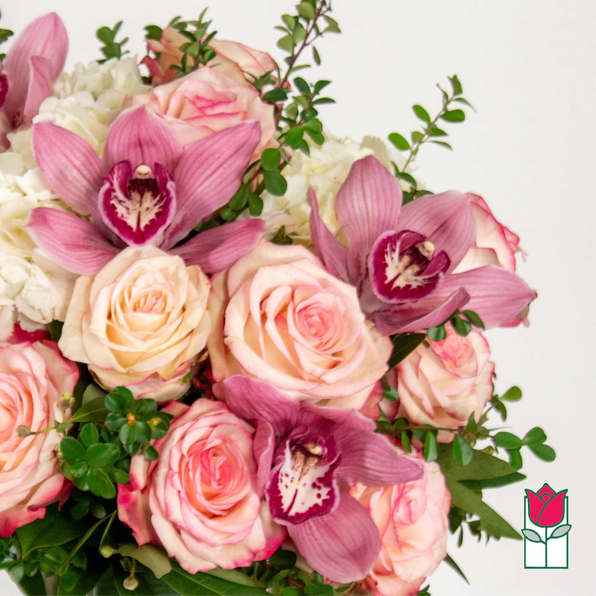 Pink roses and purple orchids in a bouquet