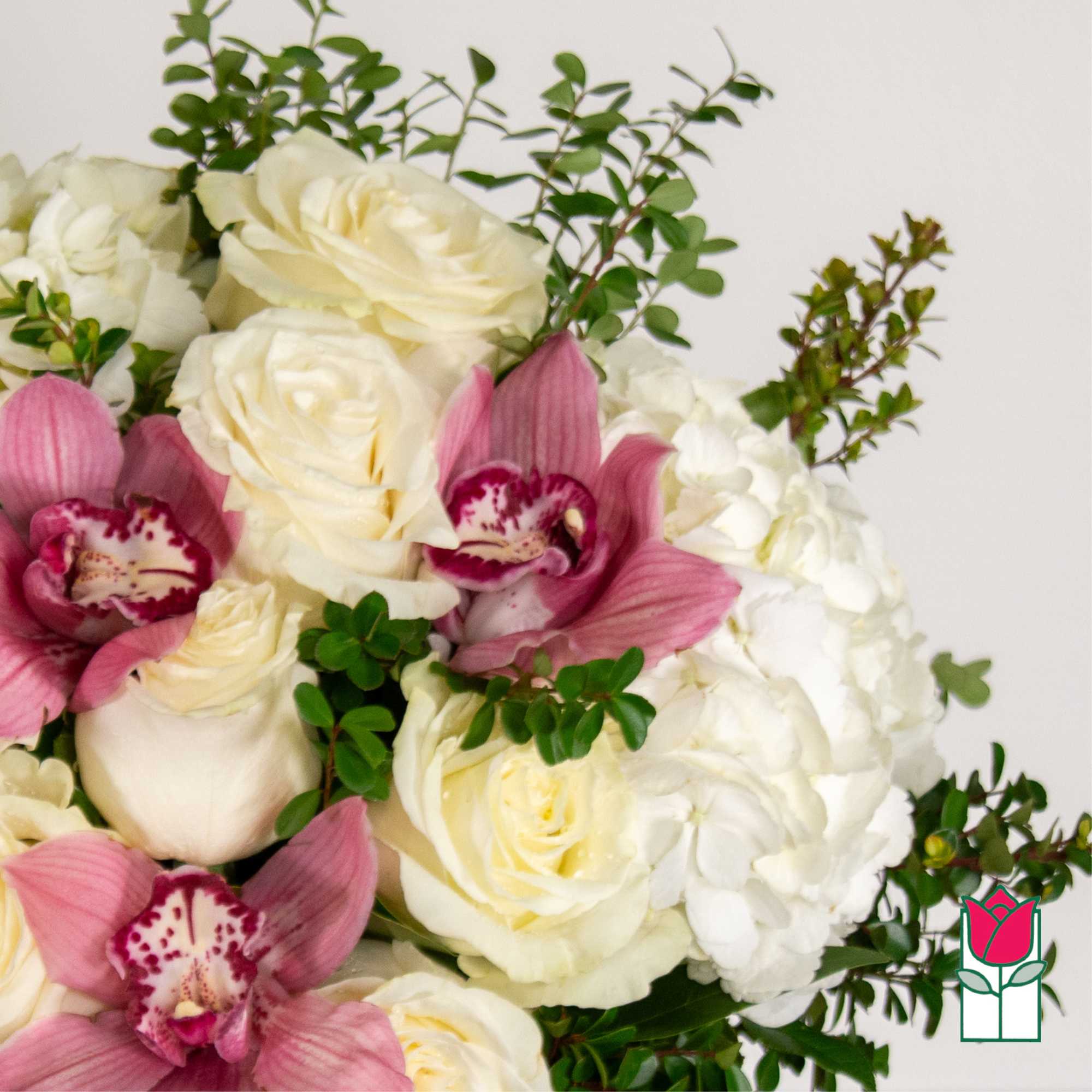 Bouquet of white roses, pink orchids, and white hydrangeas