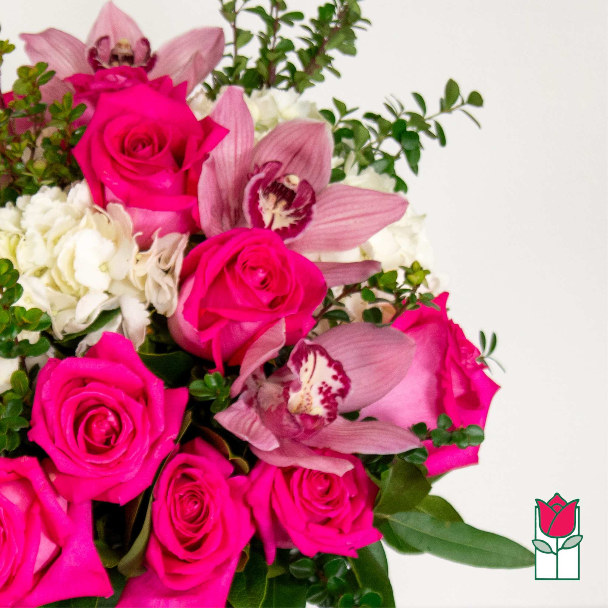 Bouquet of hot pink roses and pink orchids with white blooms