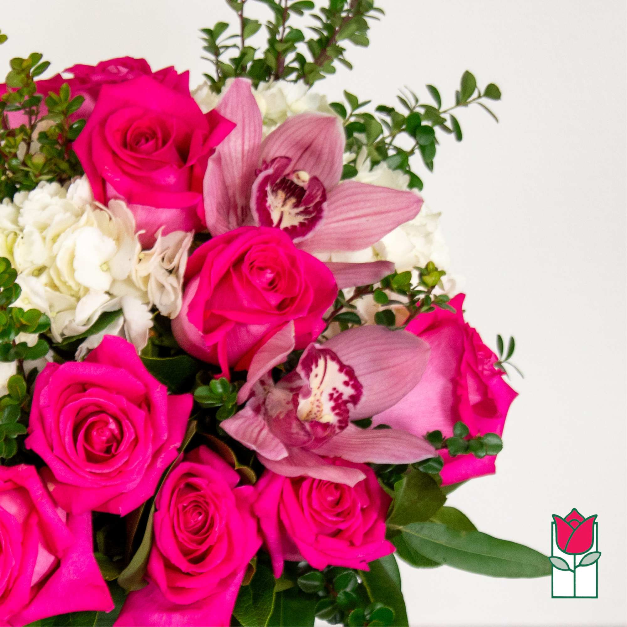 Bouquet of hot pink roses and pink orchids with white flowers