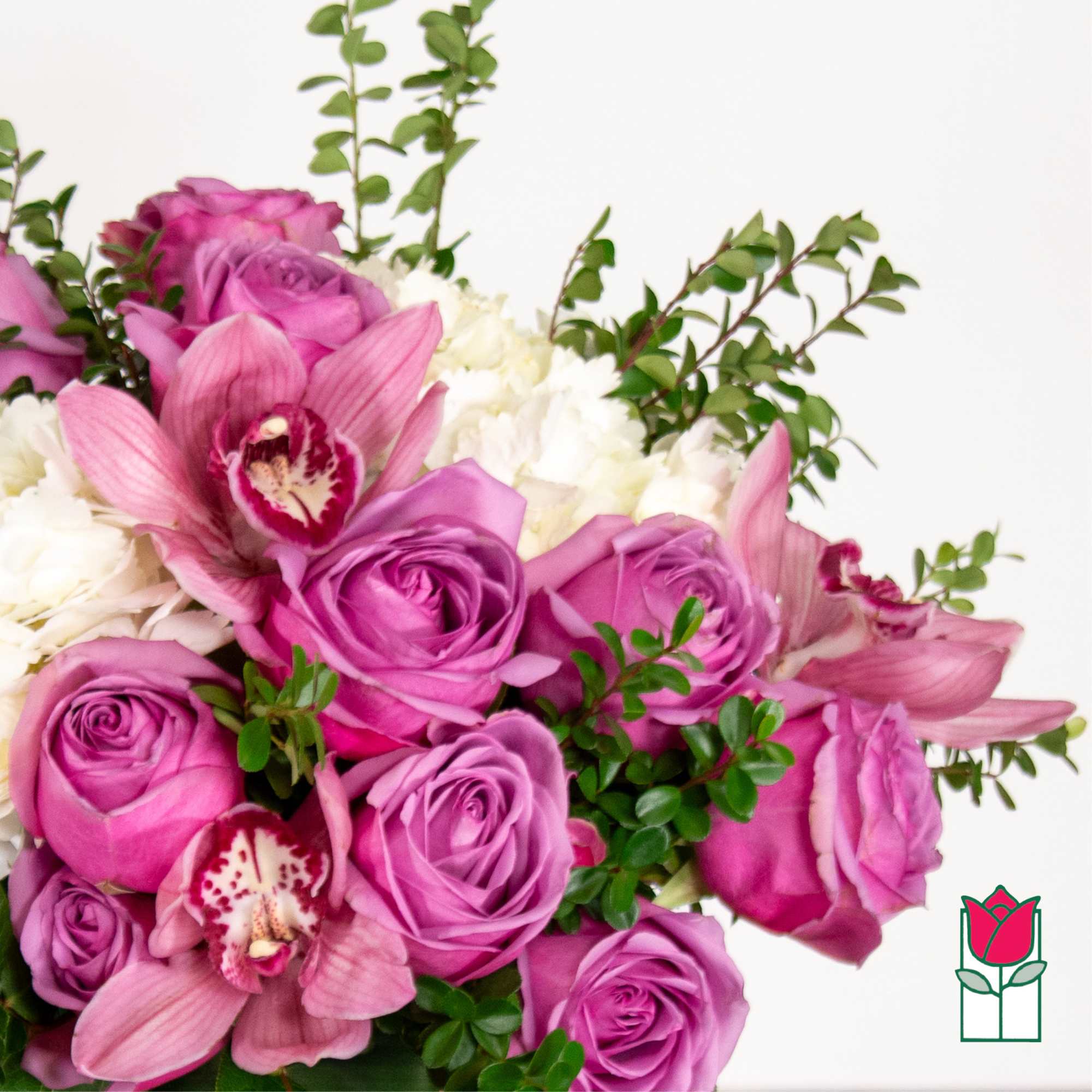 Bouquet of pink roses, pink orchids, and white flowers