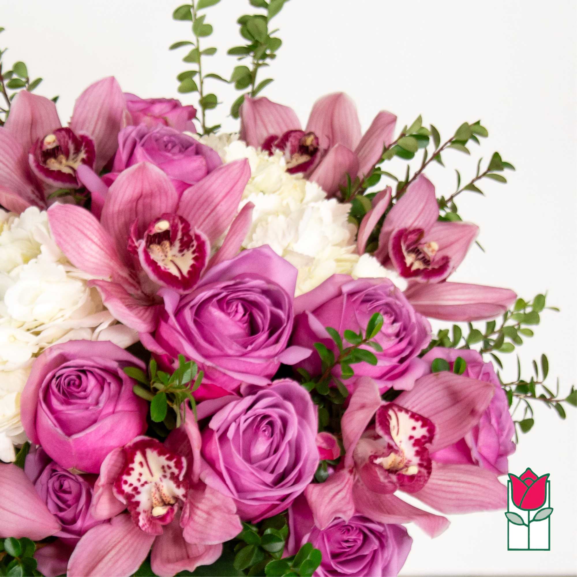 Bouquet of pink roses, orchids, and white carnations