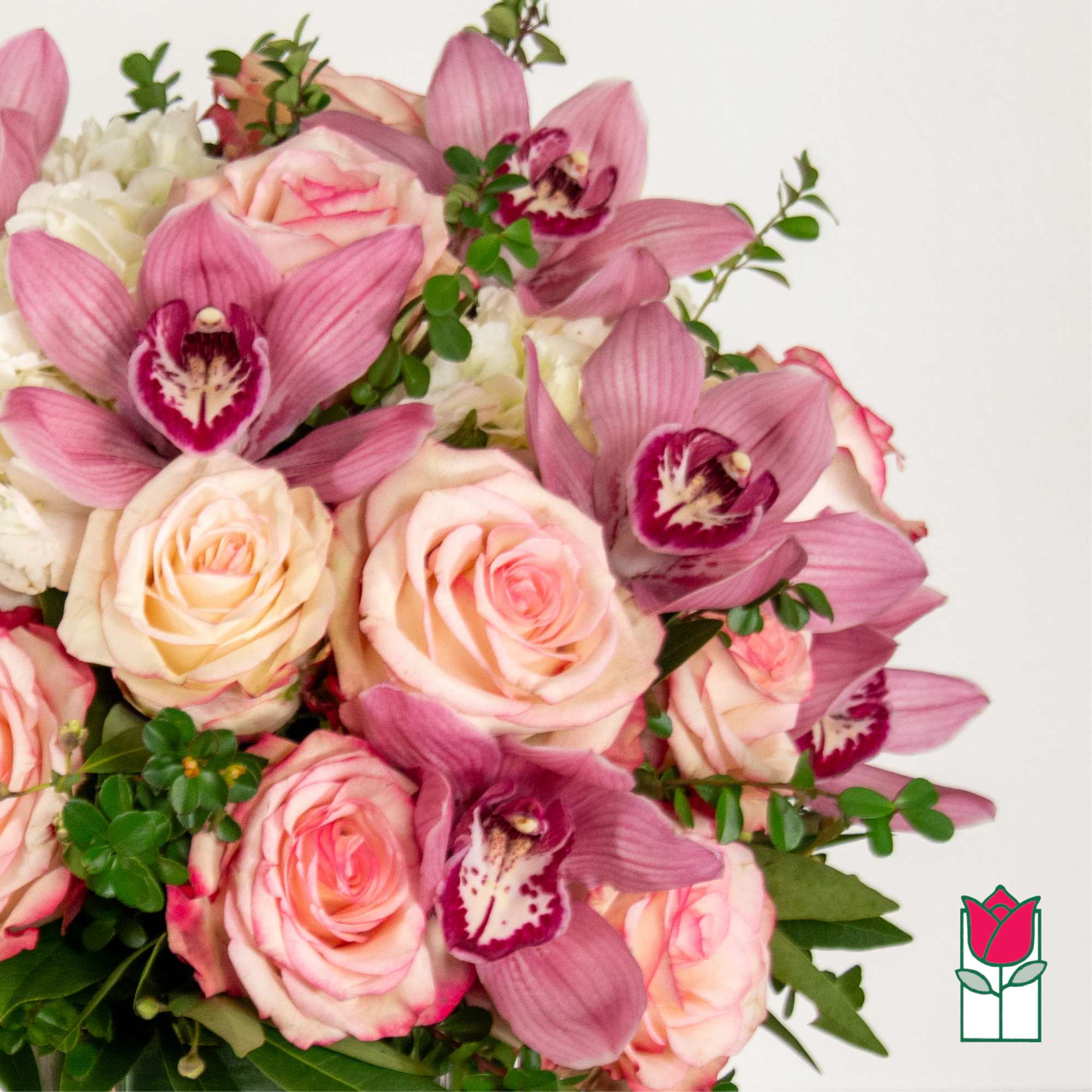 Bouquet of pink roses and purple orchids with white blooms