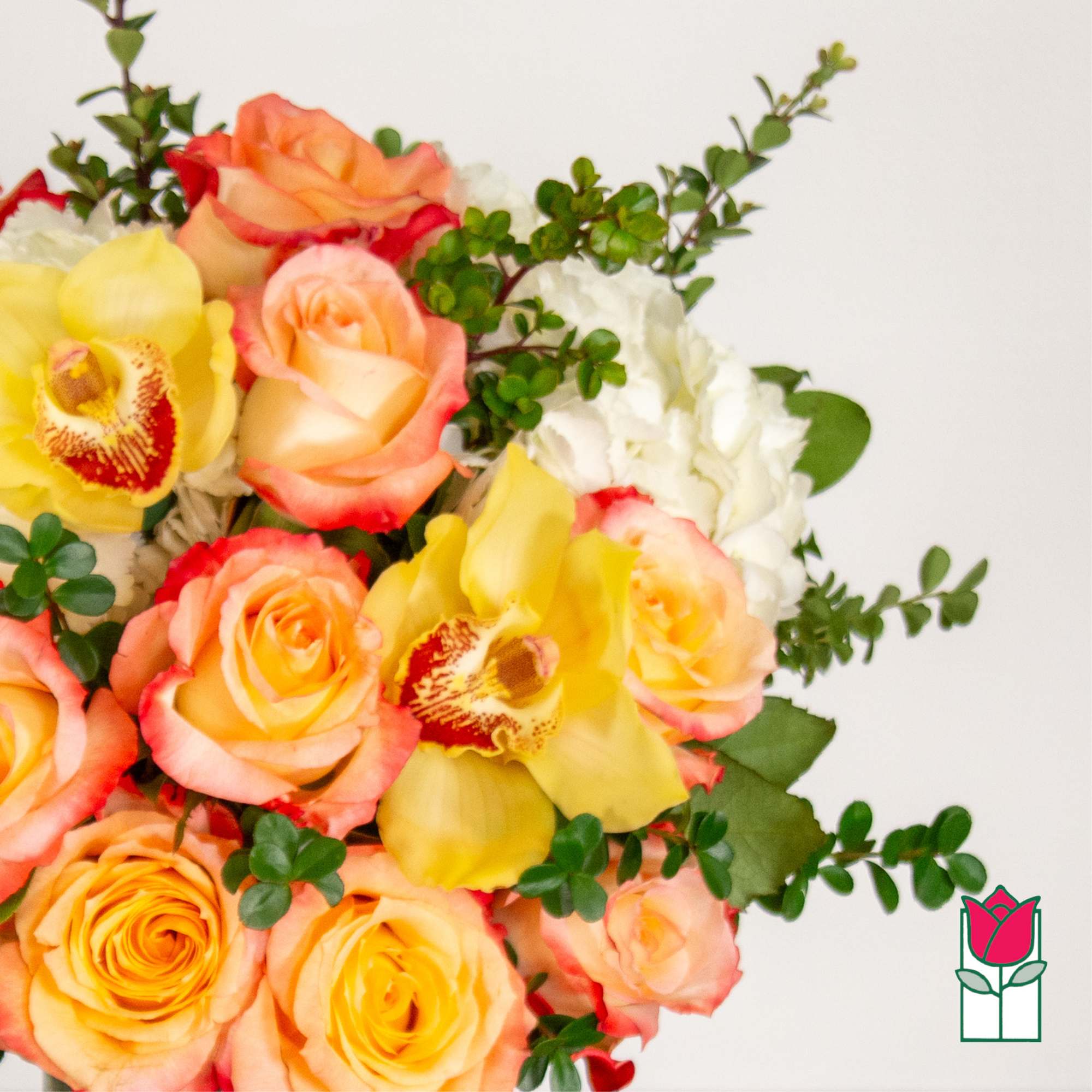 Bouquet of peach and yellow roses with white orchids