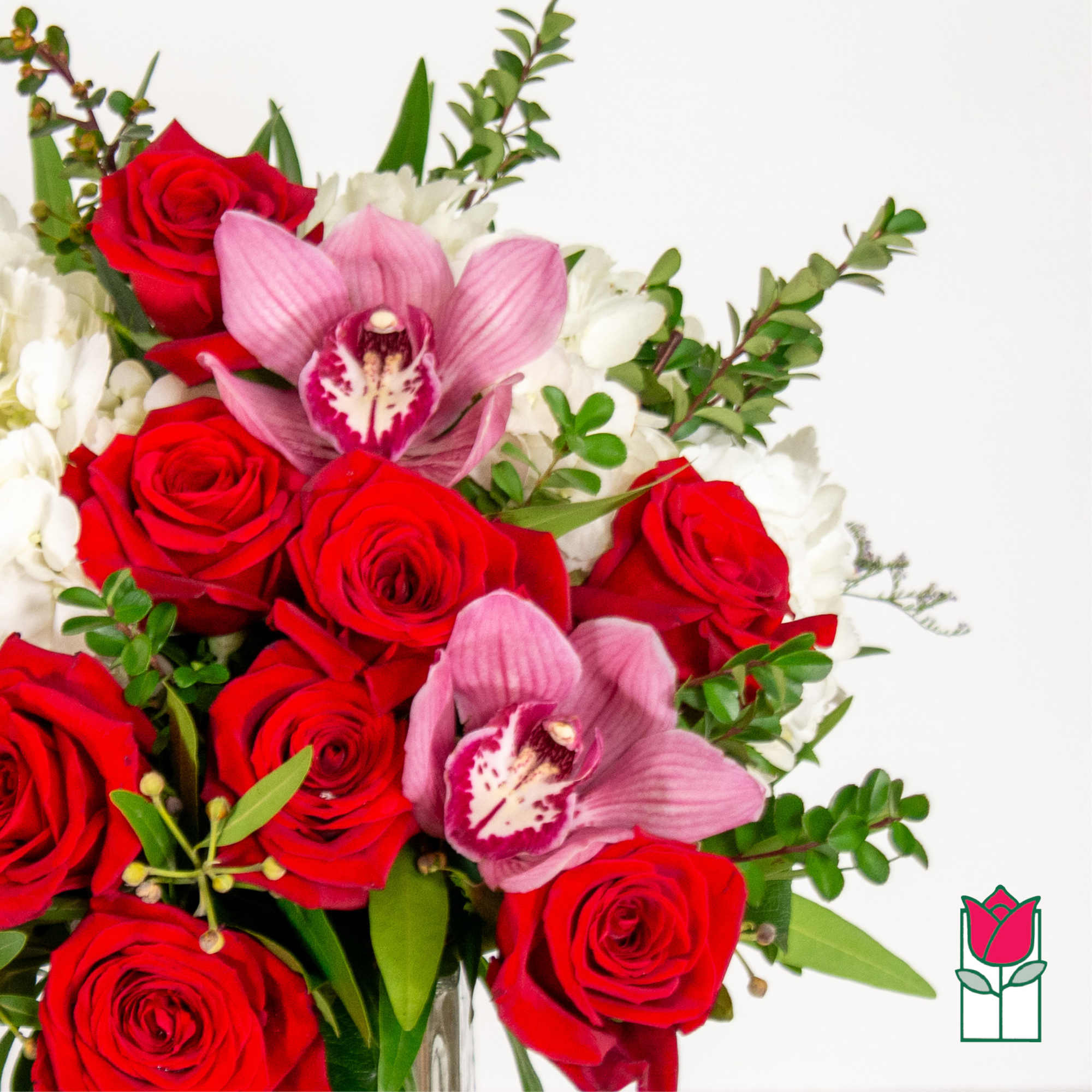 Bouquet of red roses and pink orchids with white flowers