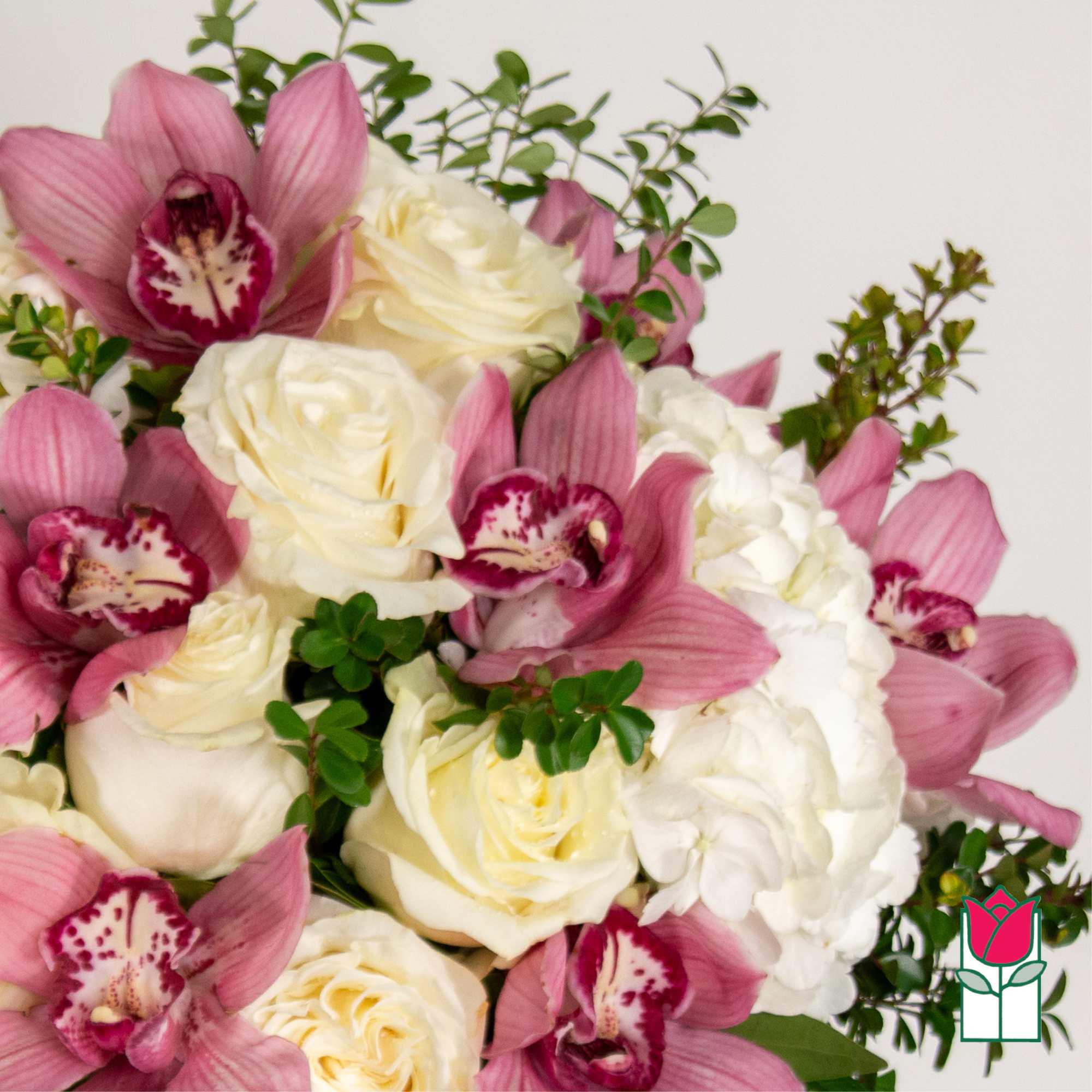 Pink orchids and white roses in a bouquet