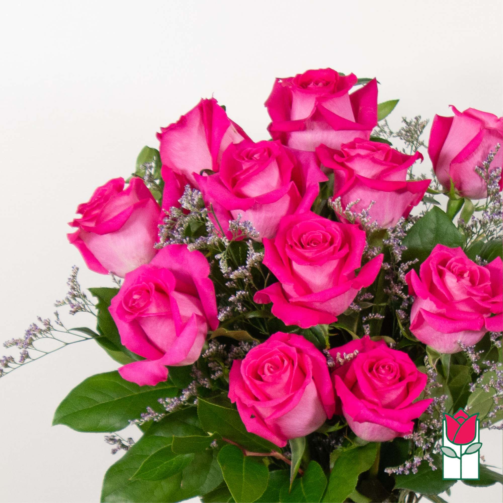 Bouquet of bright pink roses with small purple filler flowers