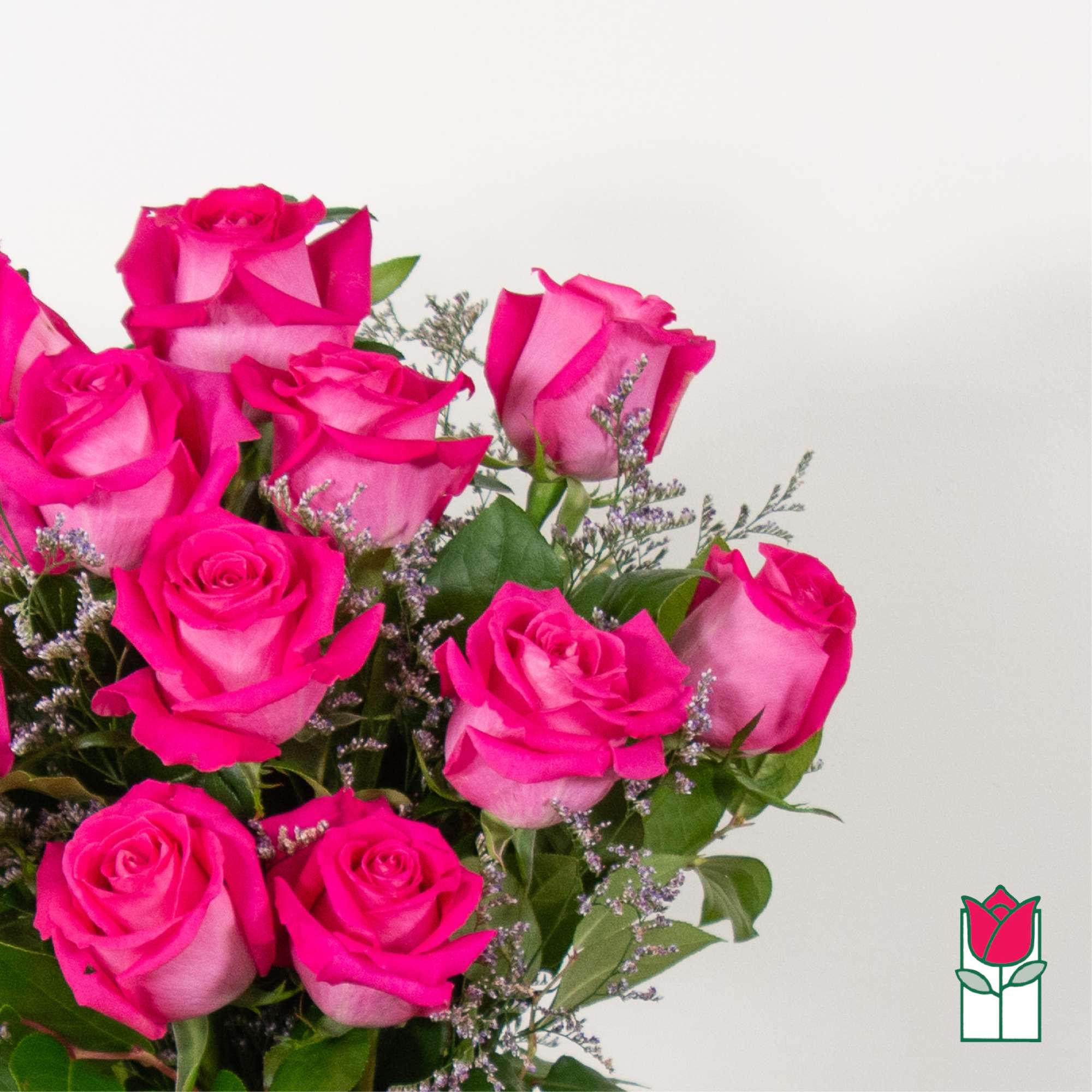 Bouquet of hot pink roses with small filler flowers