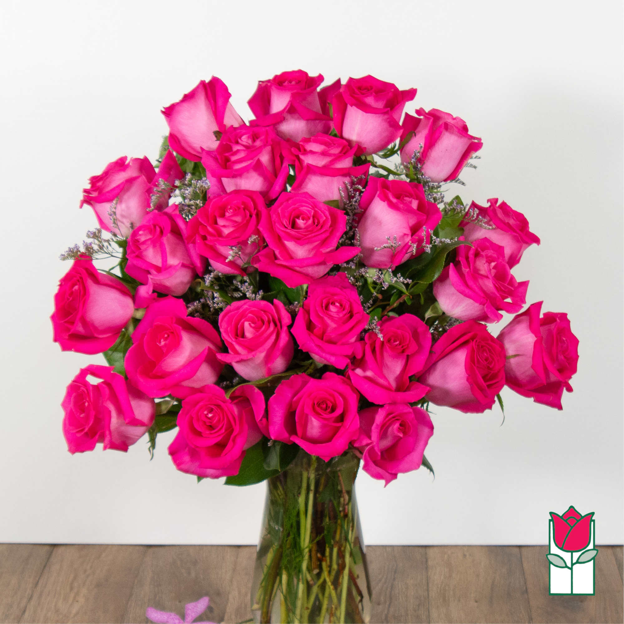 Bouquet of hot pink roses in a clear glass vase