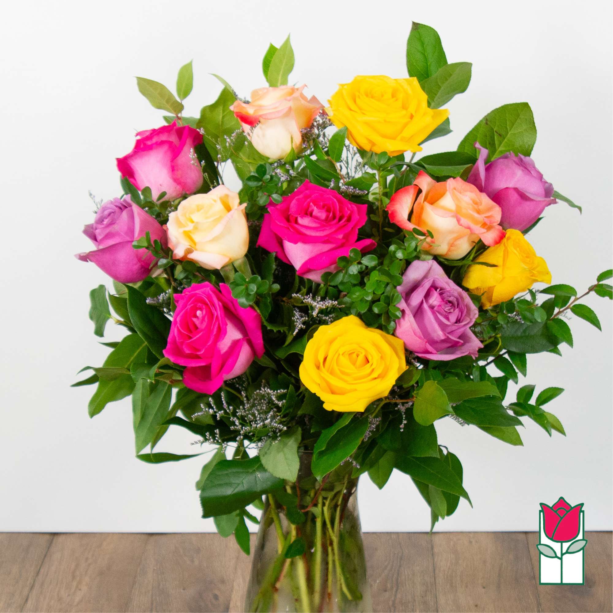 Mixed roses in a clear glass vase