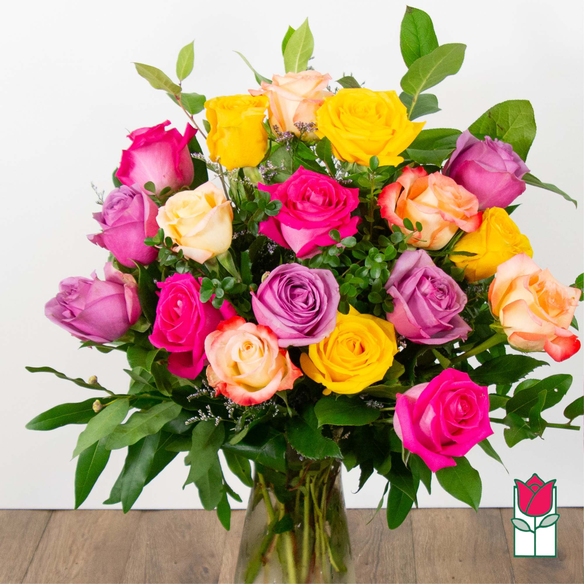 Bouquet of multicolored roses in a glass vase