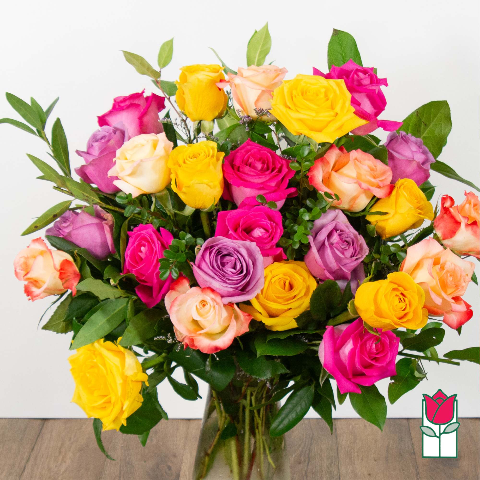 Bouquet of multicolored roses in a clear glass vase, photo 3 of 8