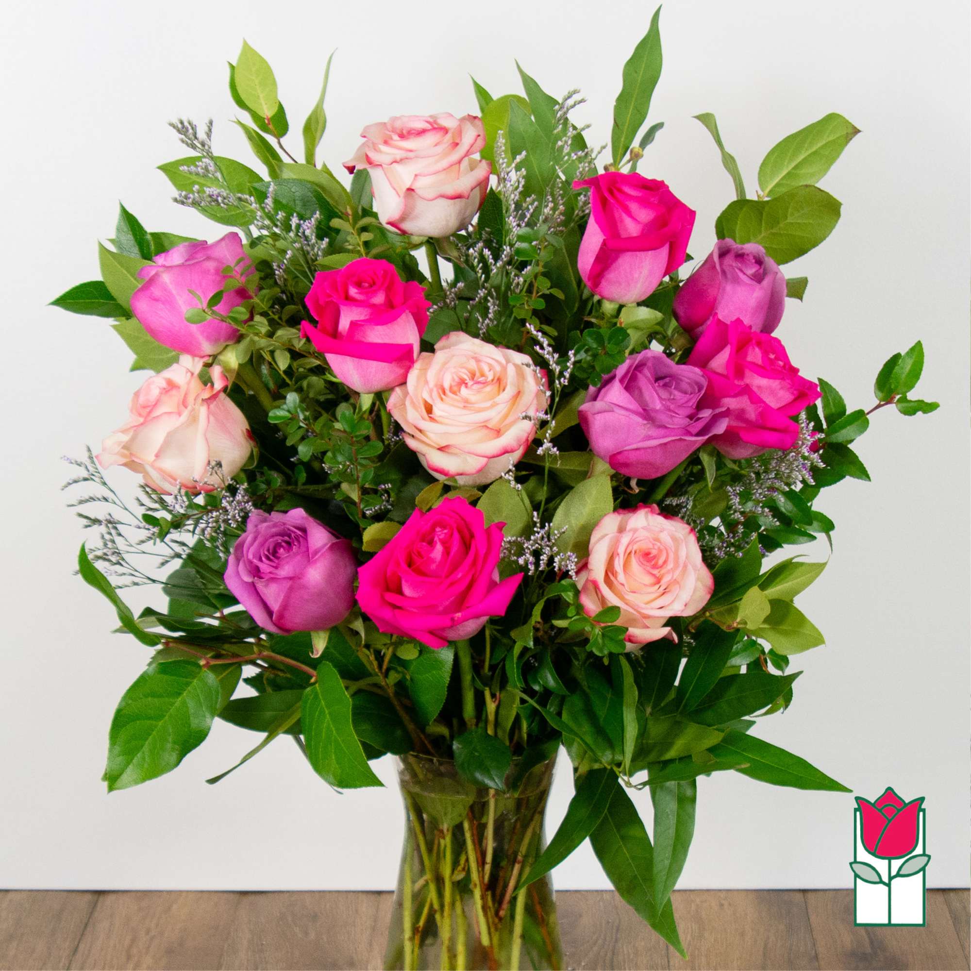 Bouquet of pink and purple roses in a glass vase