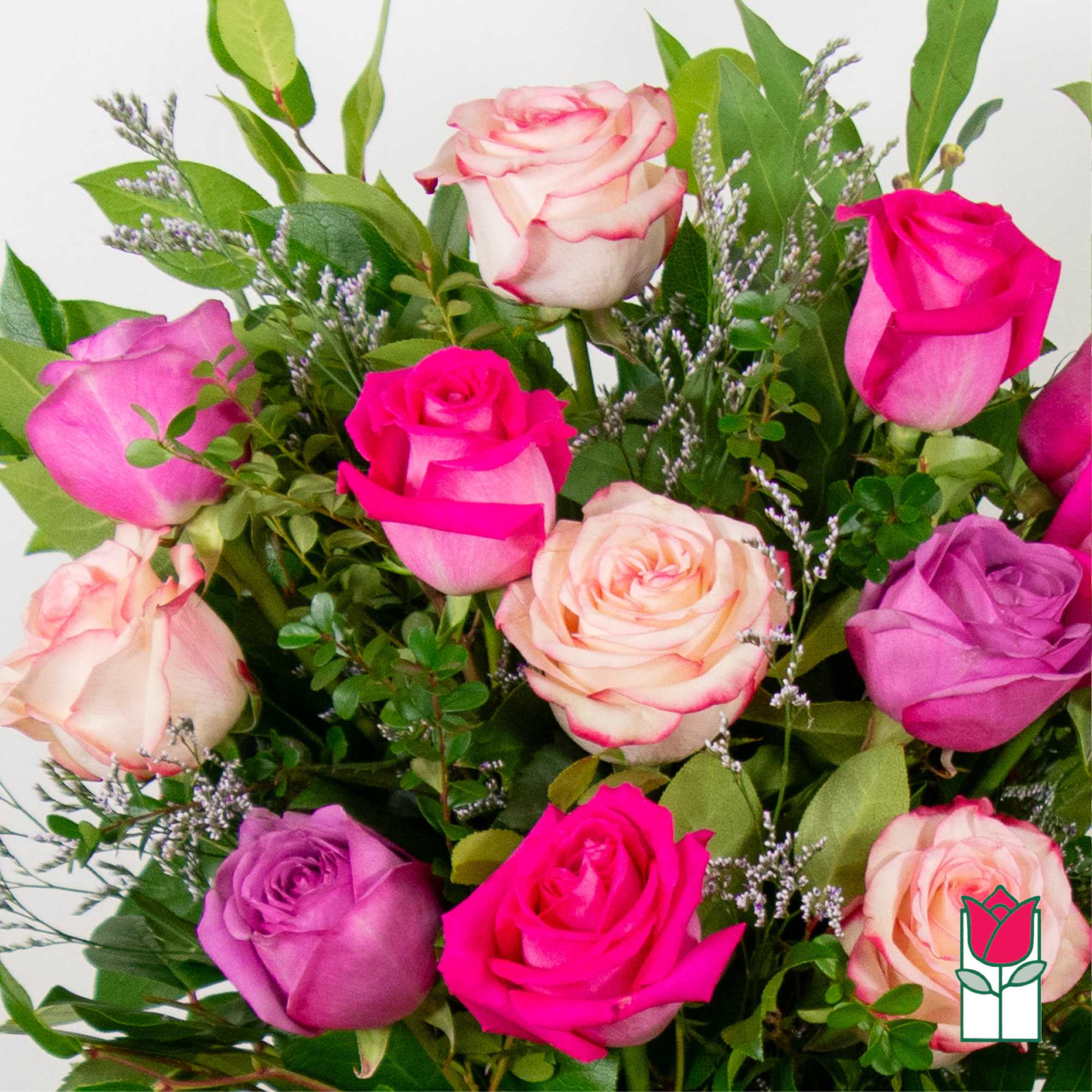 Bouquet of pink, purple, and cream roses with greenery, photo 7 of 8