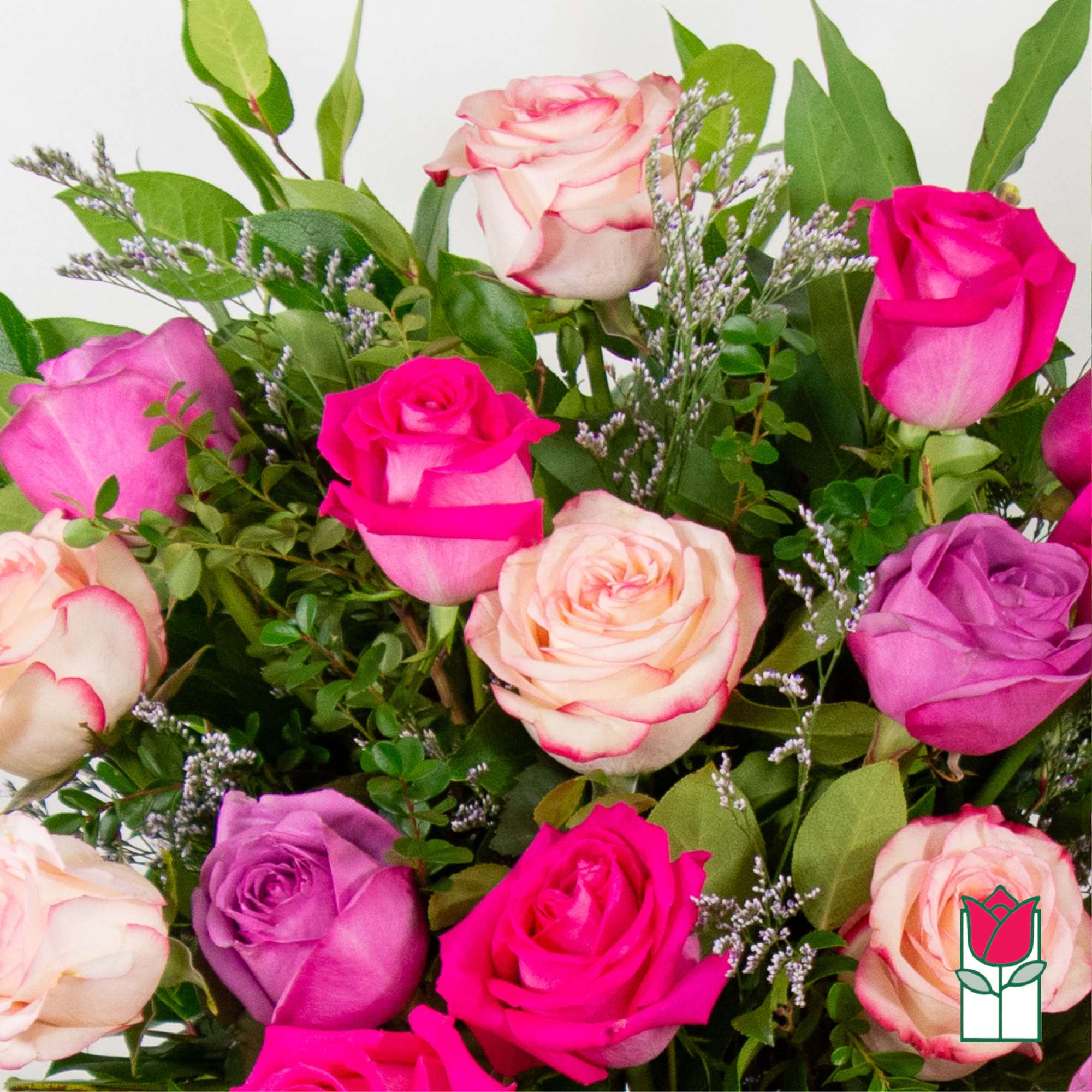 Bouquet of pink, purple, and cream roses with greenery