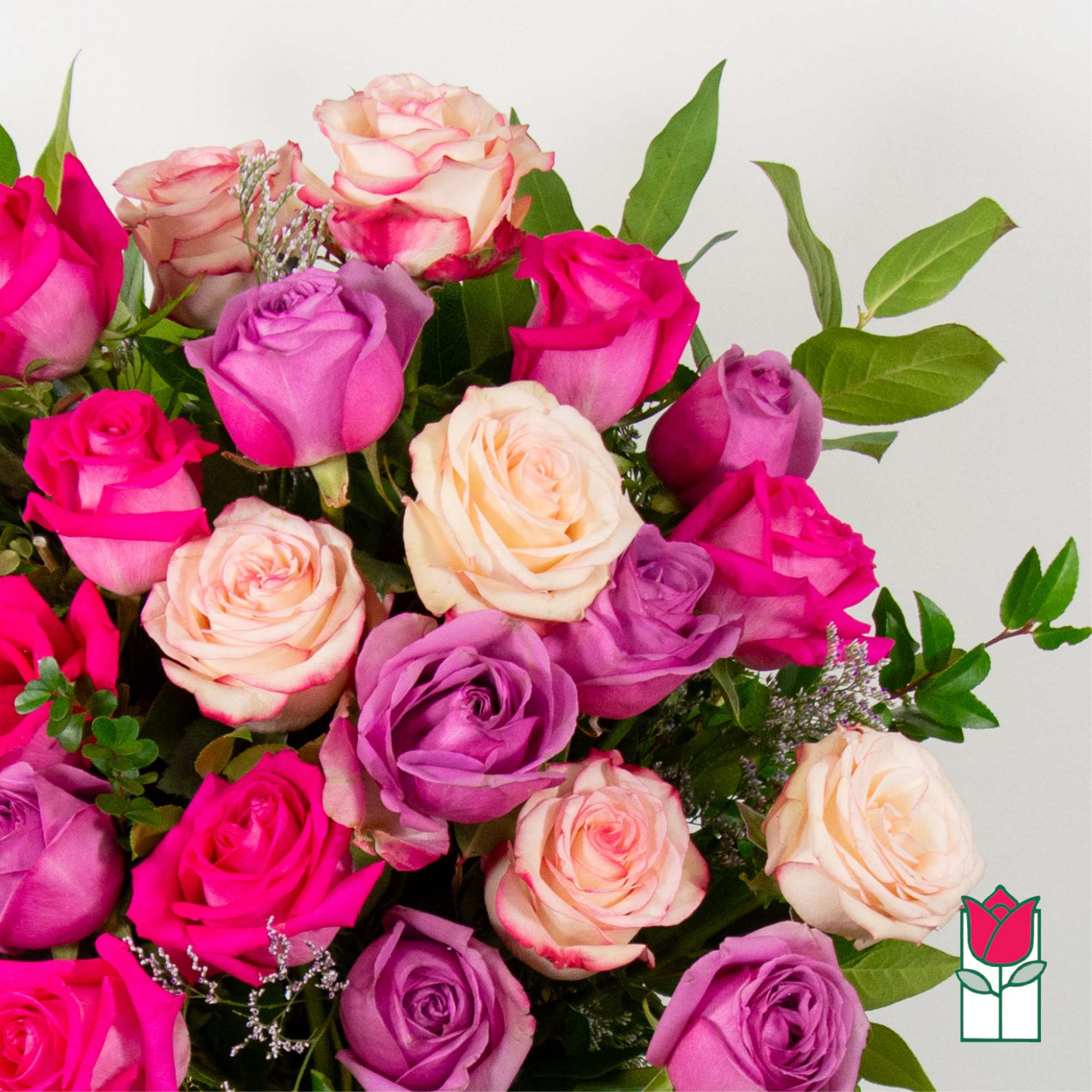 Bouquet of pink, purple, and peach roses with greenery