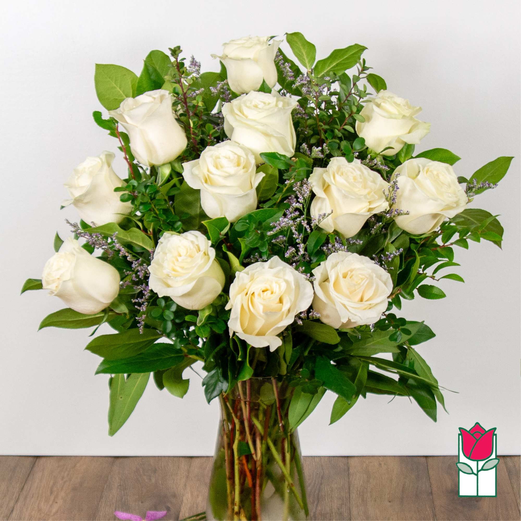 Bouquet of white roses in a clear glass vase