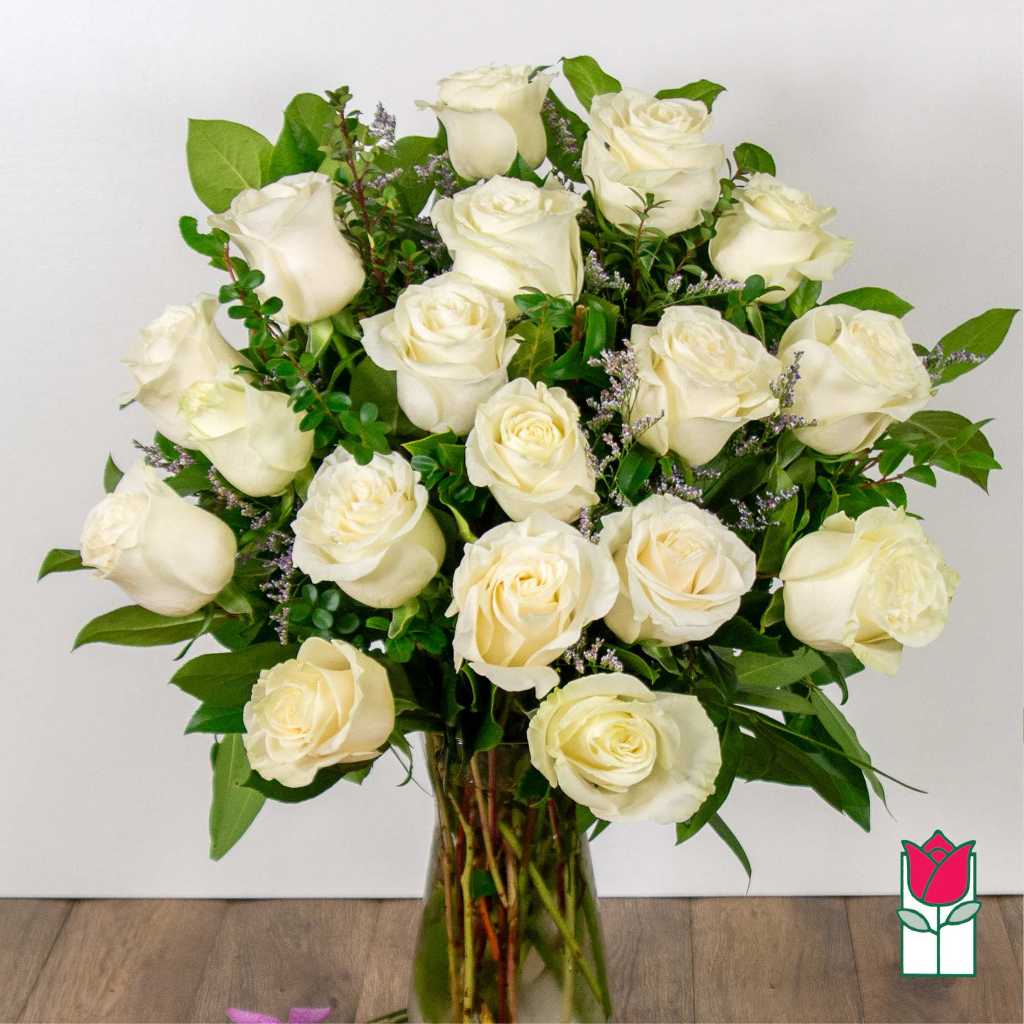 Bouquet of white roses in a clear glass vase