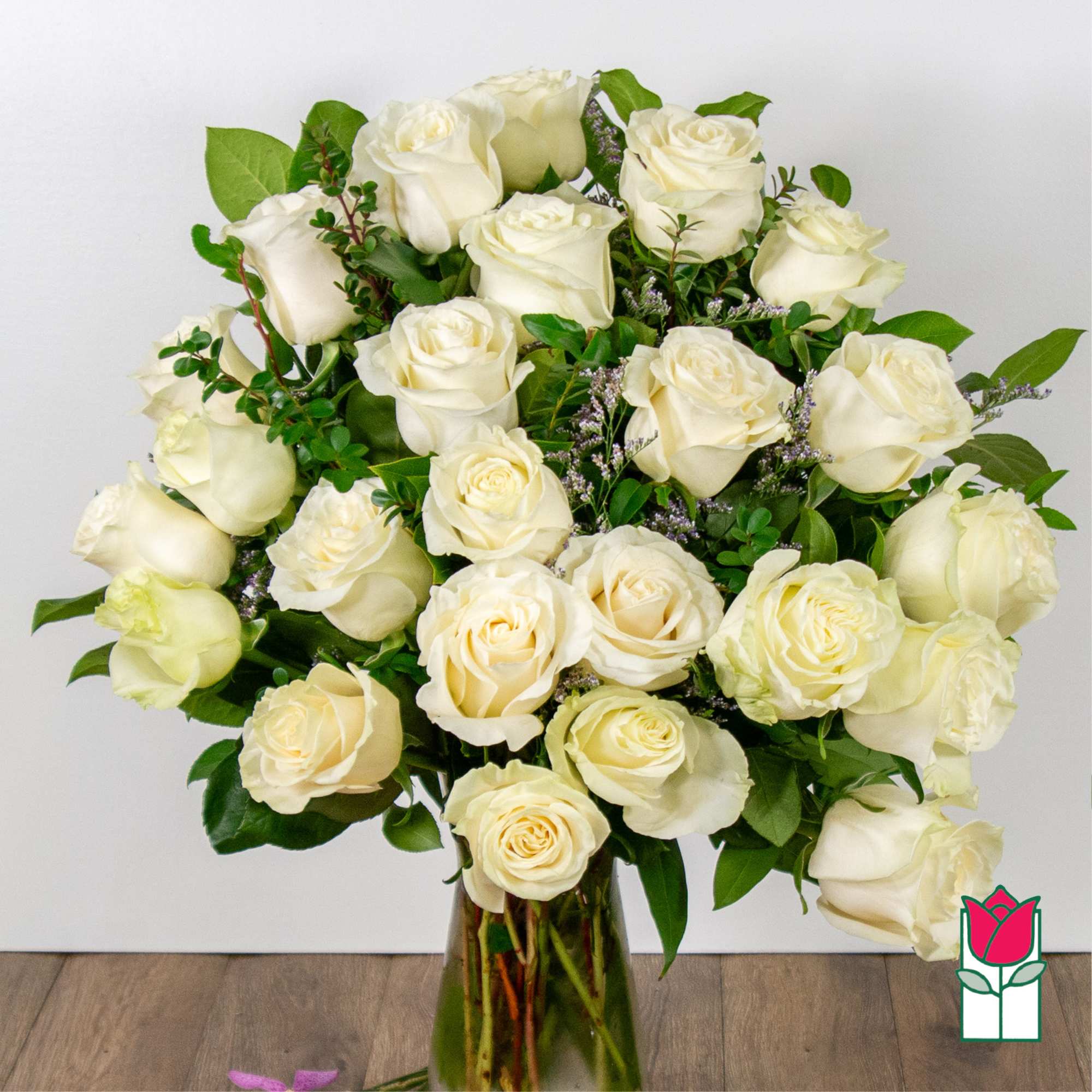 Bouquet of white roses in a glass vase