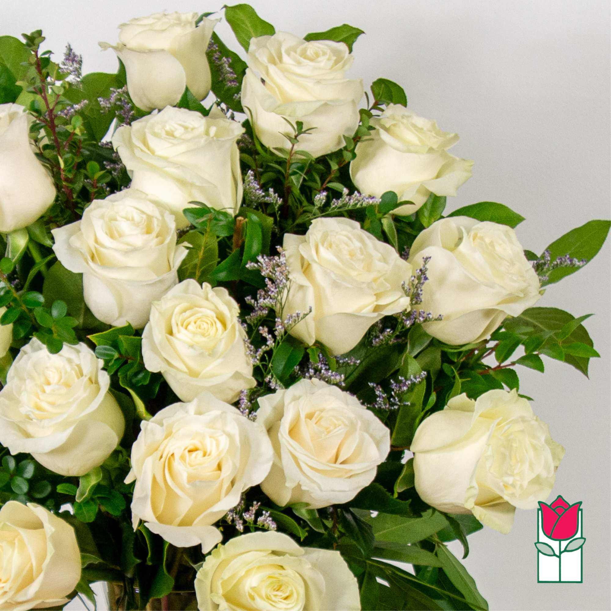 Bouquet of white roses with small purple filler flowers