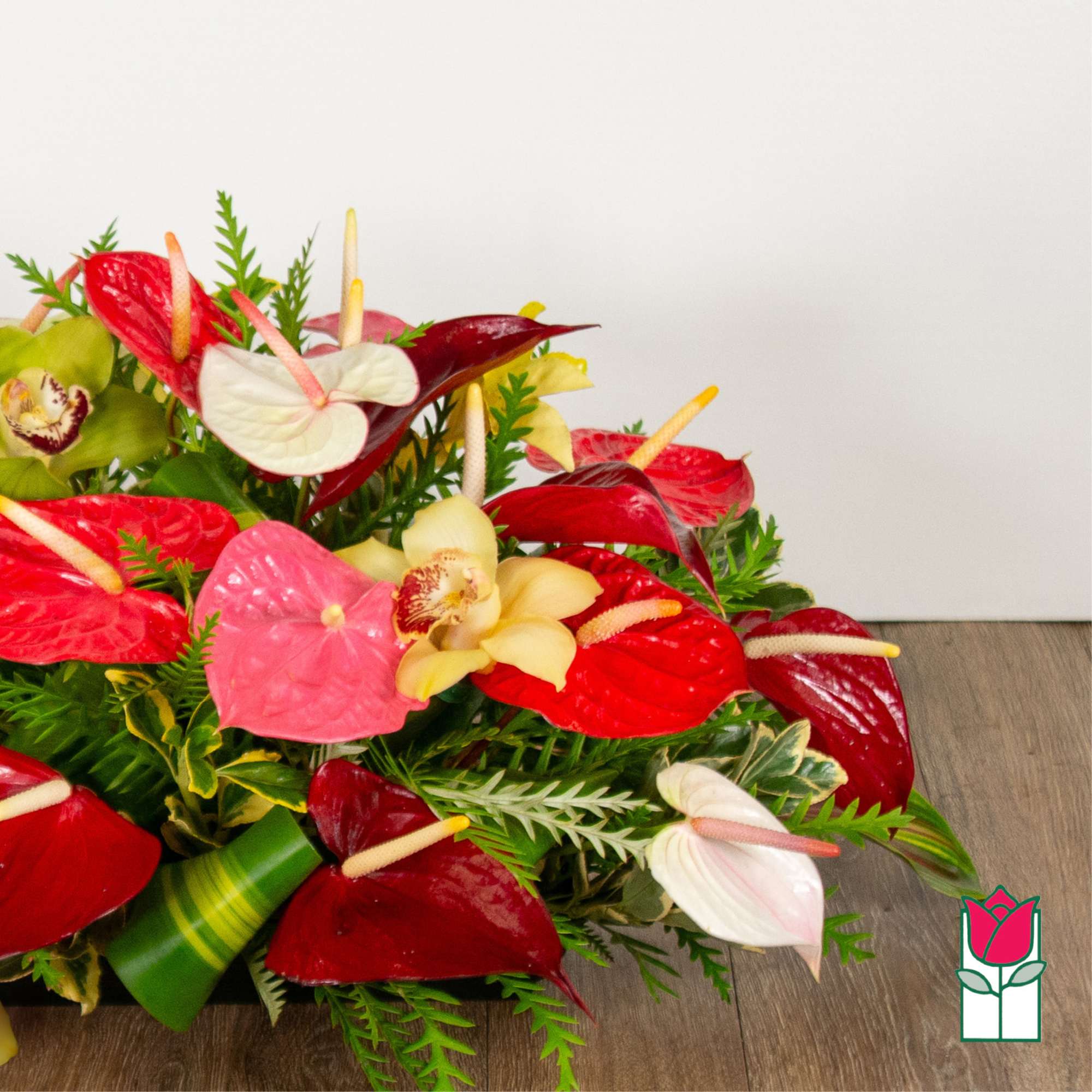 Tropical bouquet with red and pink anthuriums and orchids