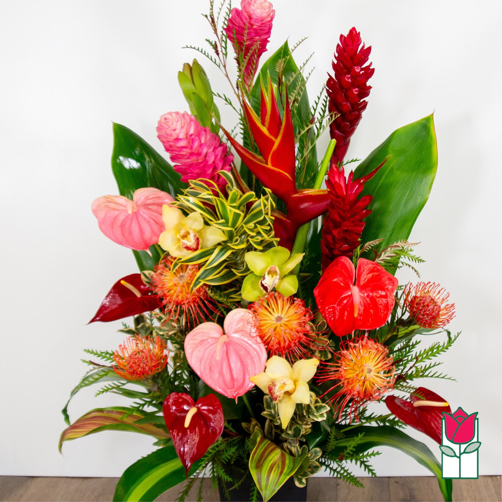 Tropical bouquet with red anthuriums, orchids, and pink ginger flowers