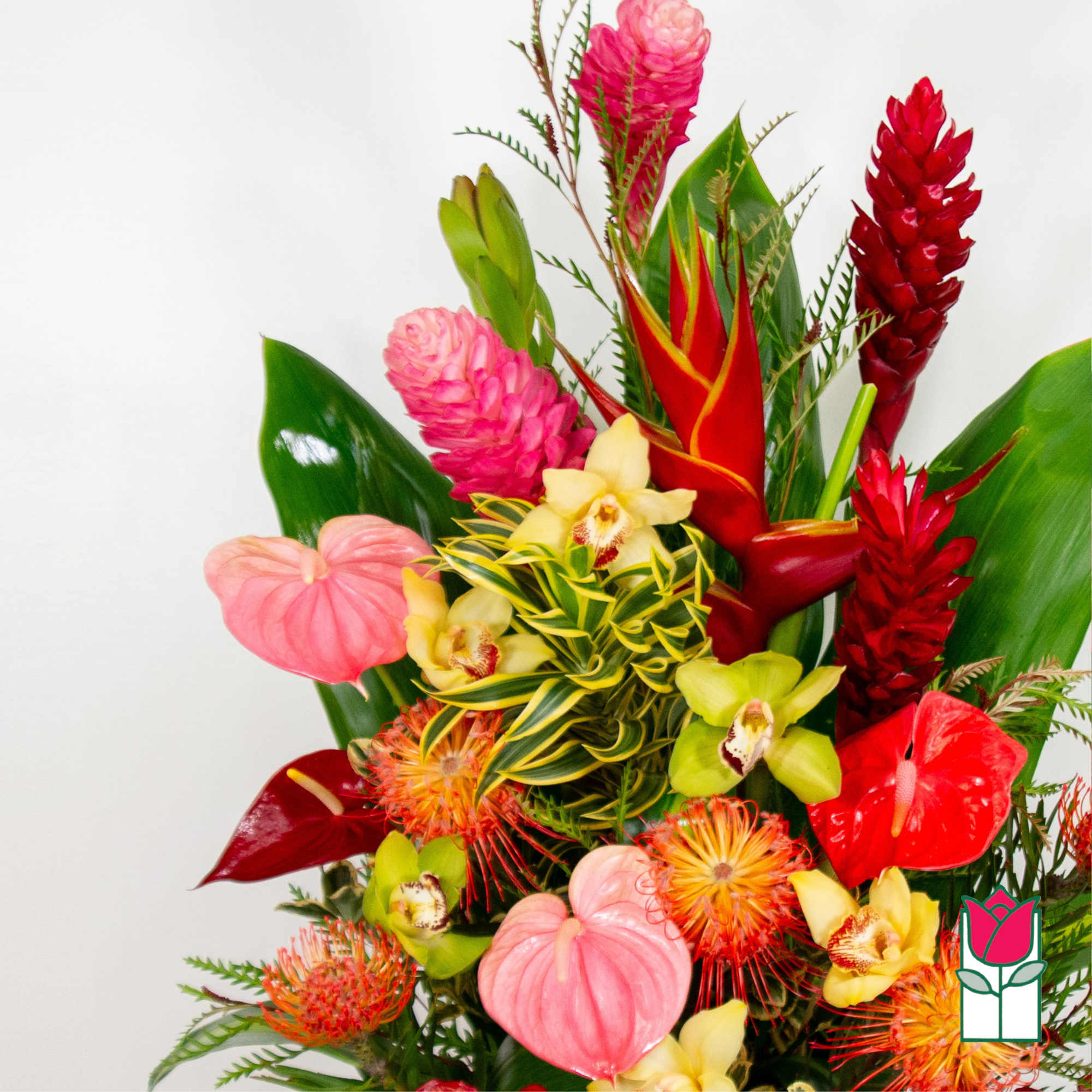 Tropical bouquet with red and pink blooms and yellow orchids