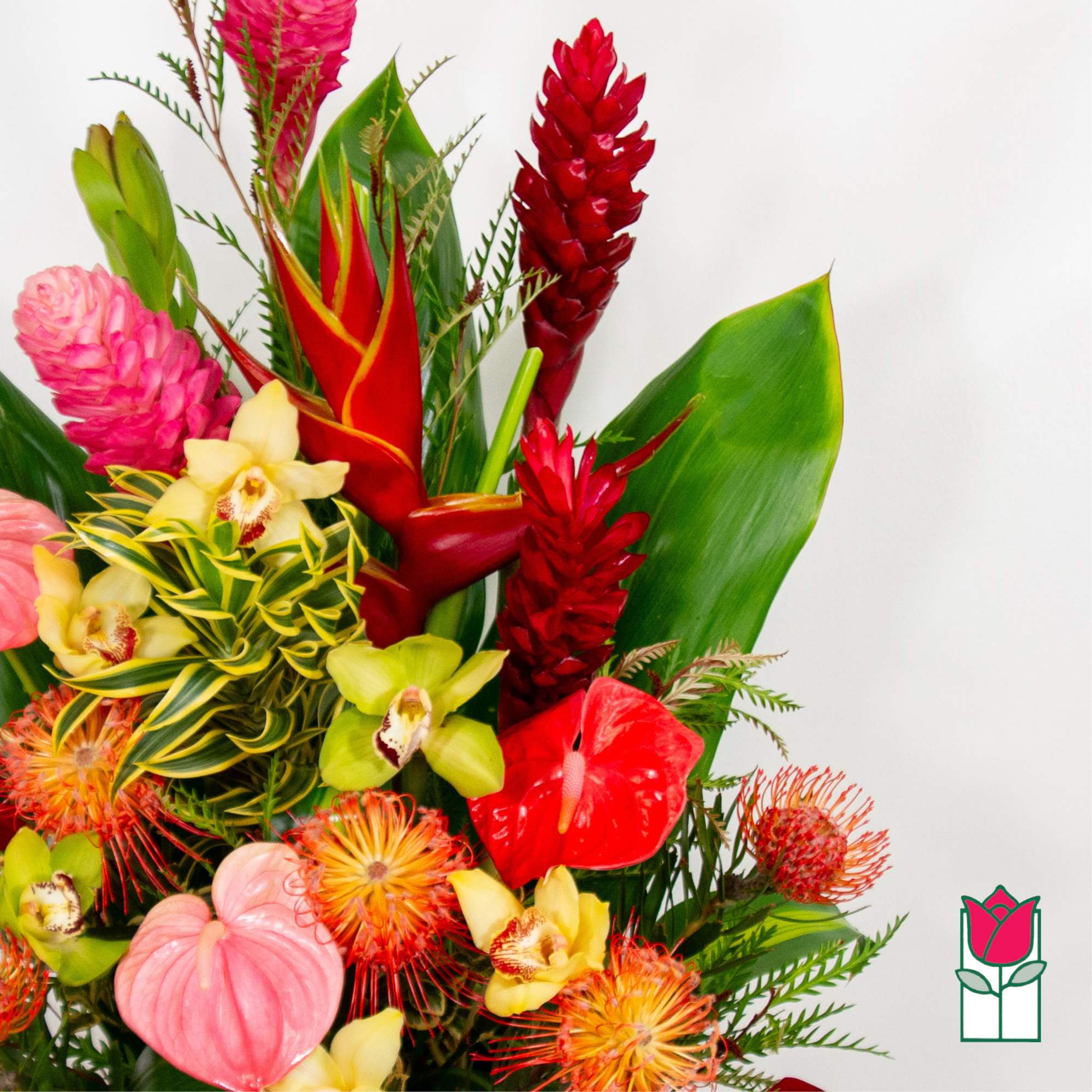 Tropical bouquet with red ginger, orchids, and pink blooms