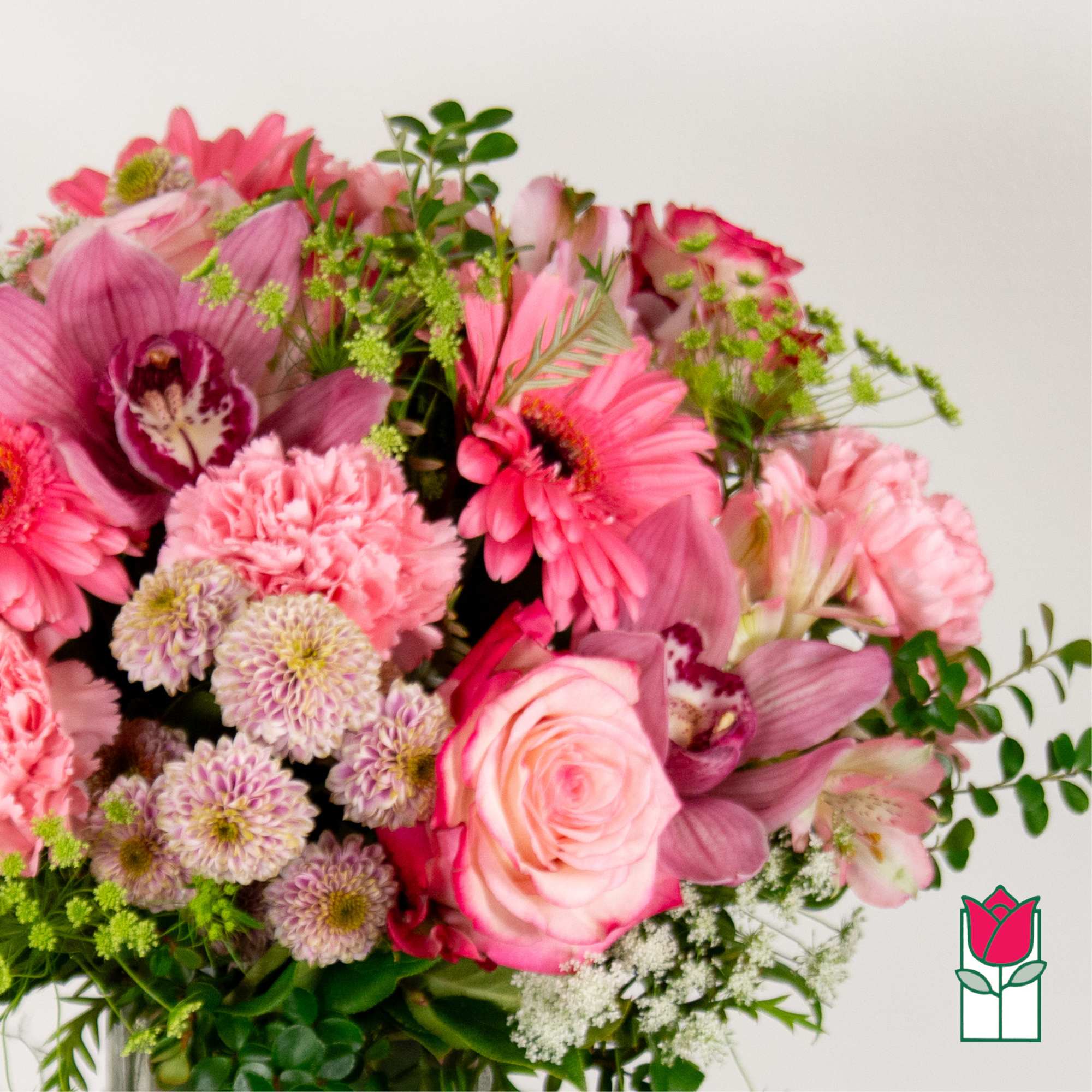 Pink mixed bouquet with roses, orchids, carnations, and daisies