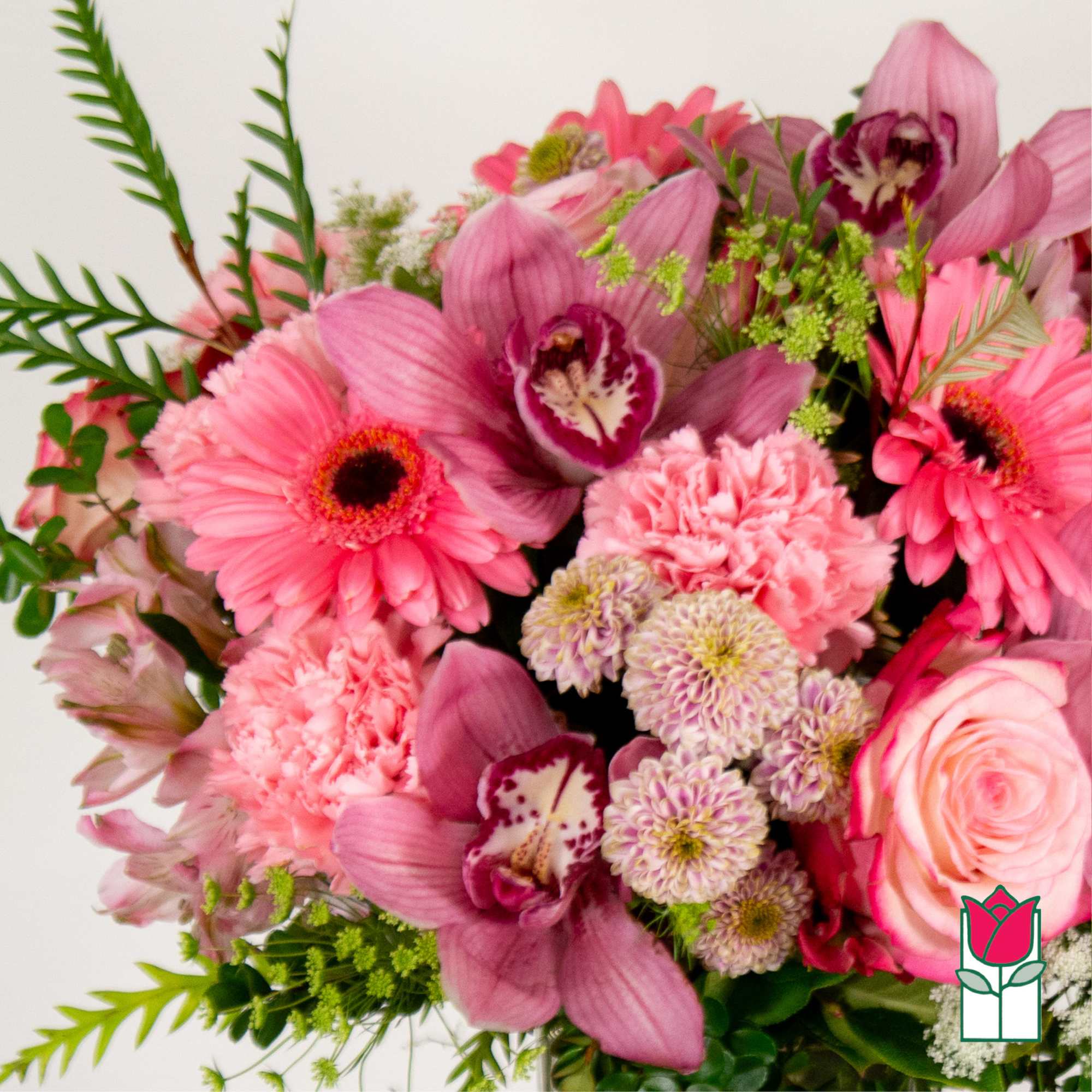 Pink bouquet with gerbera daisies, orchids, carnations, and a rose