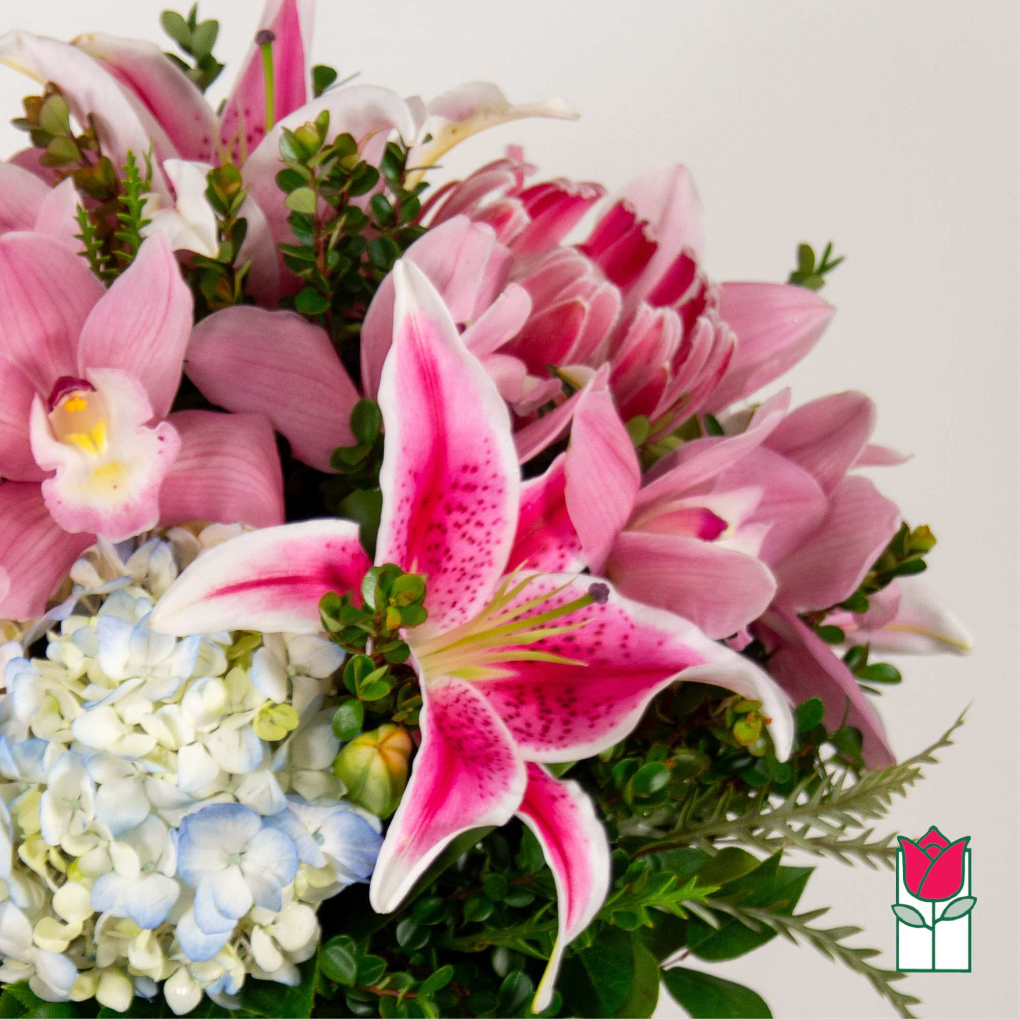 Pink lilies and hydrangeas in a mixed bouquet