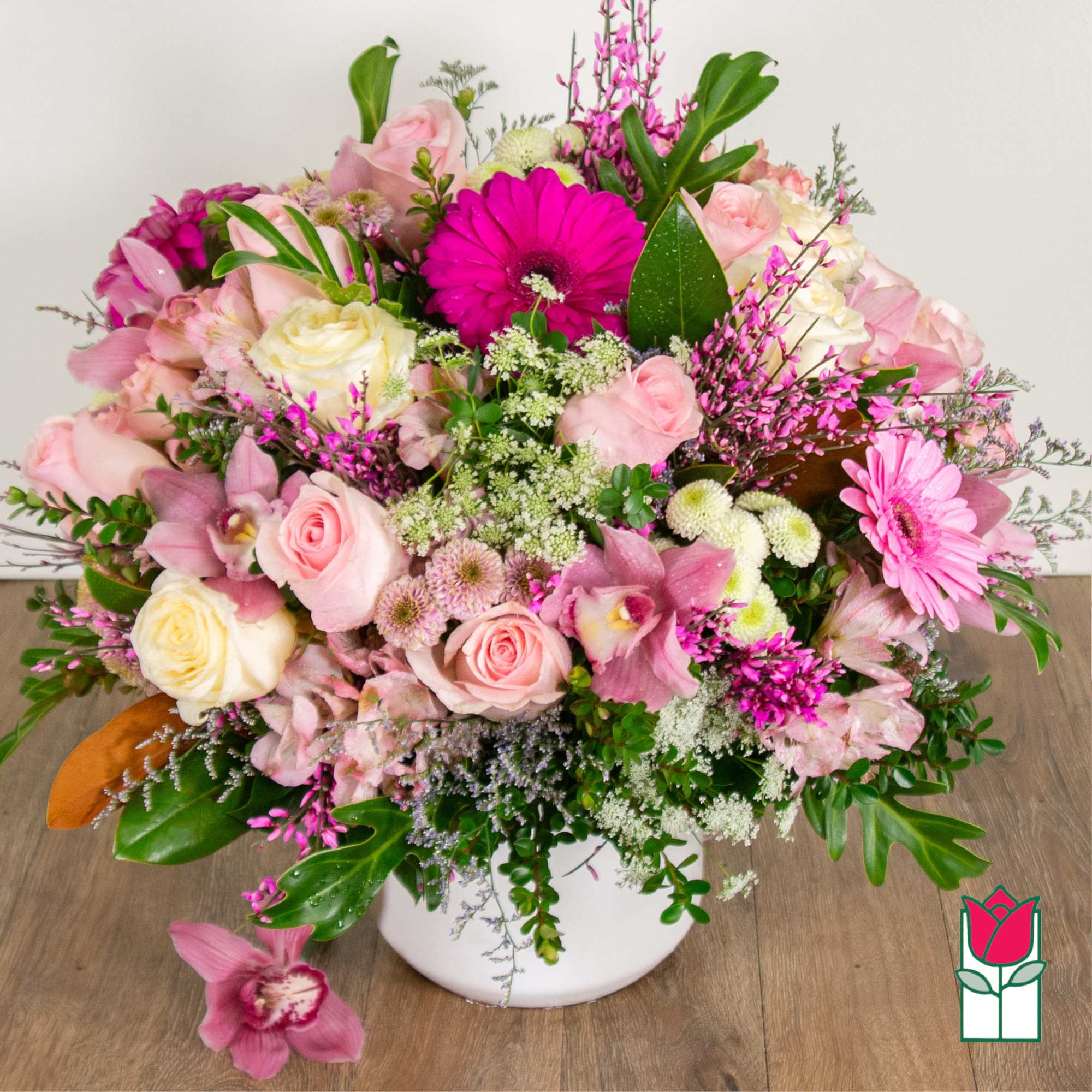 Pink and white mixed flower arrangement in a white vase, photo 2 of 4
