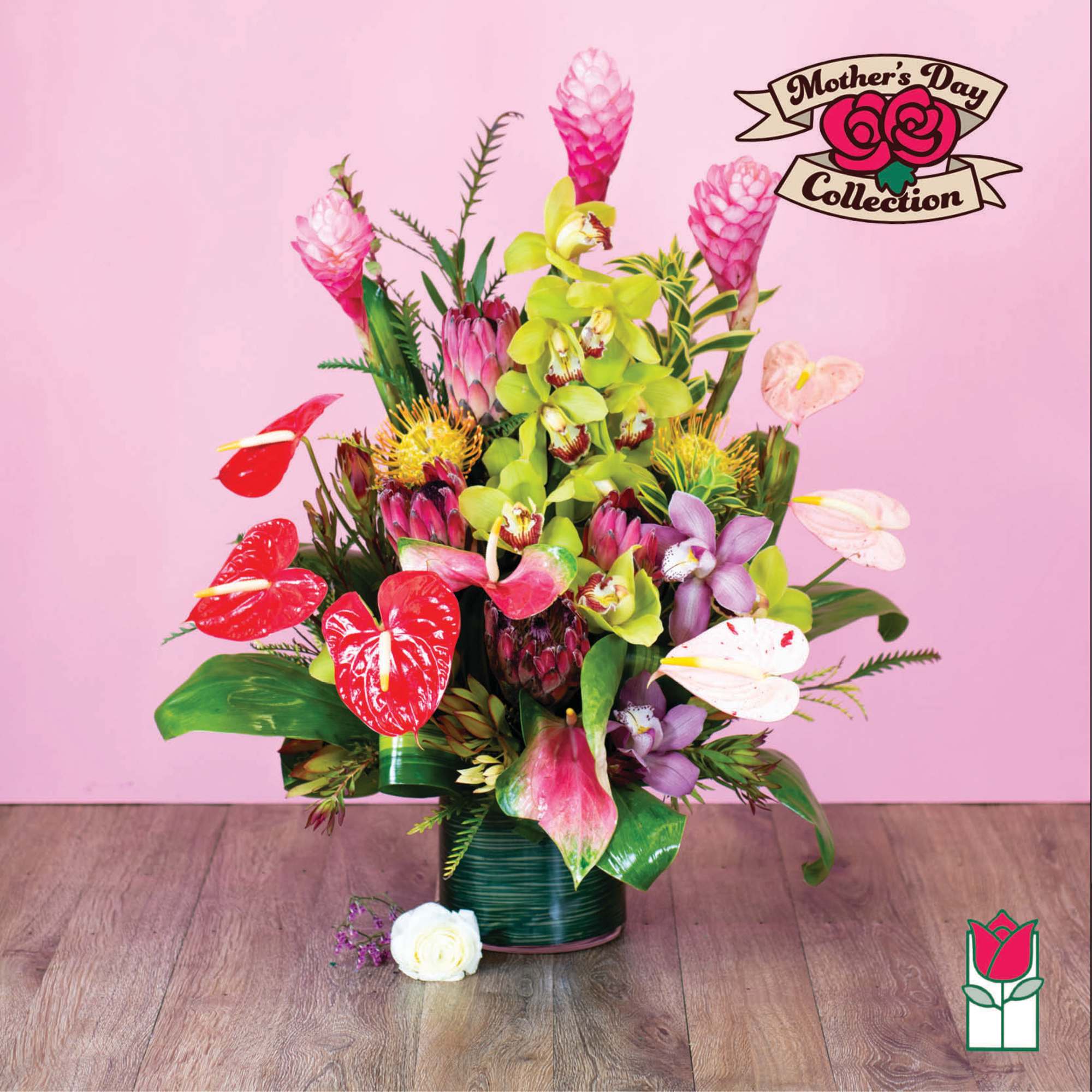 Tropical bouquet in a vase with pink, green, and purple blooms