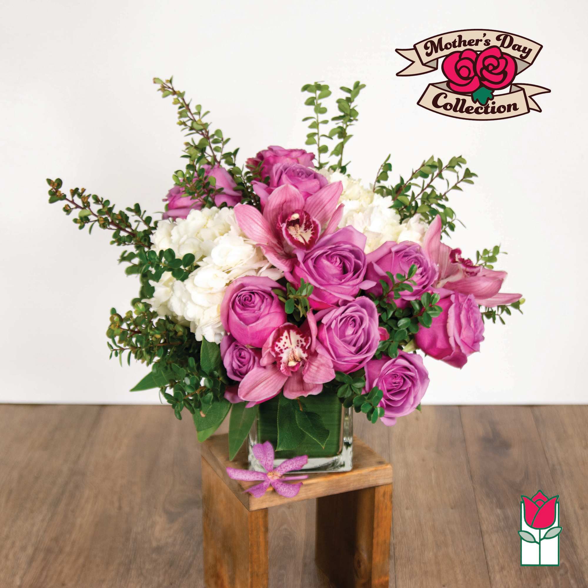 Pink and white floral arrangement in a glass vase