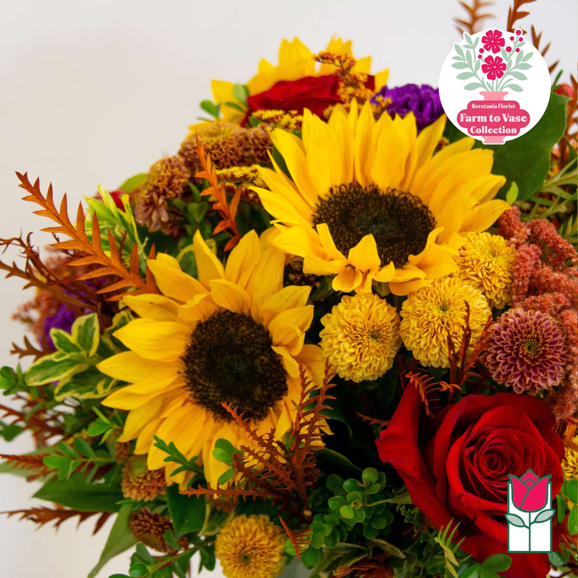 Bouquet with sunflowers, red roses, and yellow chrysanthemums