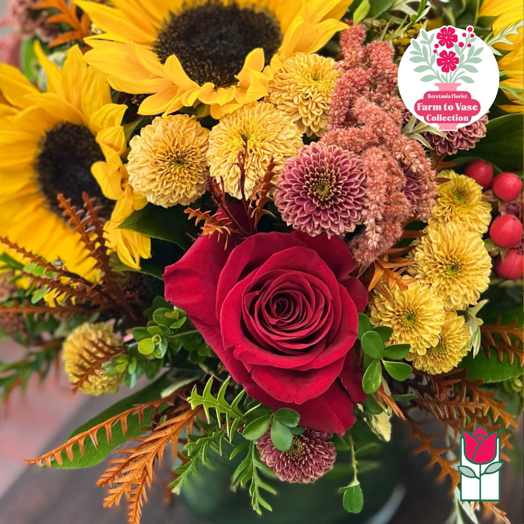 Bouquet of sunflowers, a red rose, and yellow chrysanthemums