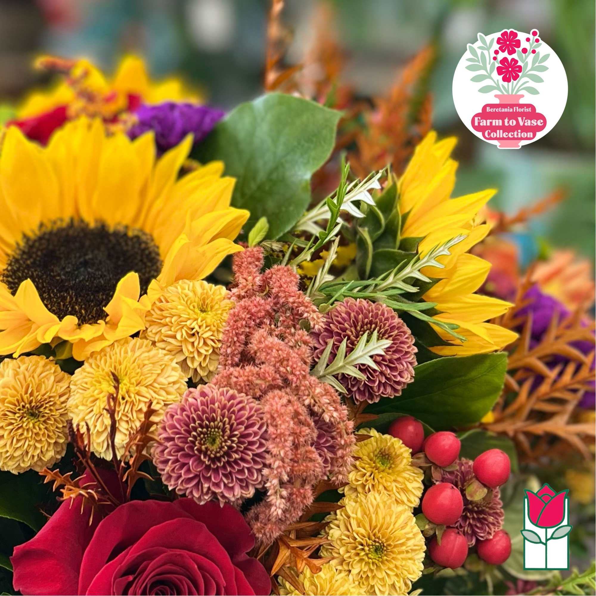 Mixed bouquet with sunflowers, roses, and chrysanthemums in bright autumn colors