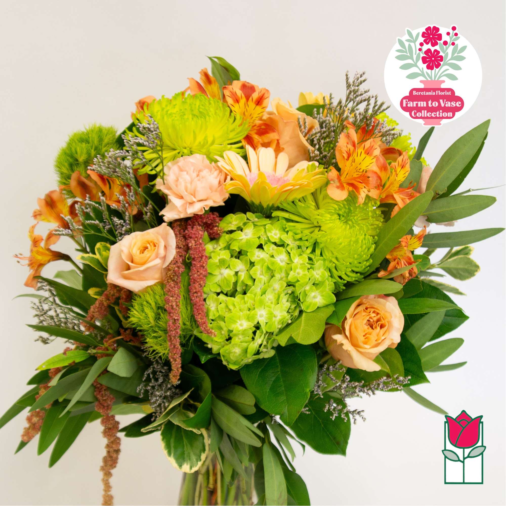 Bouquet of peach roses, green hydrangea, and orange alstroemeria
