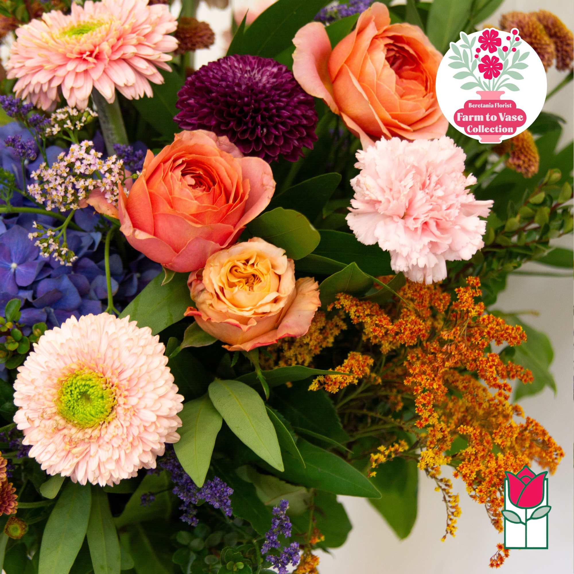 Mixed bouquet with peach, pink, purple, and orange flowers