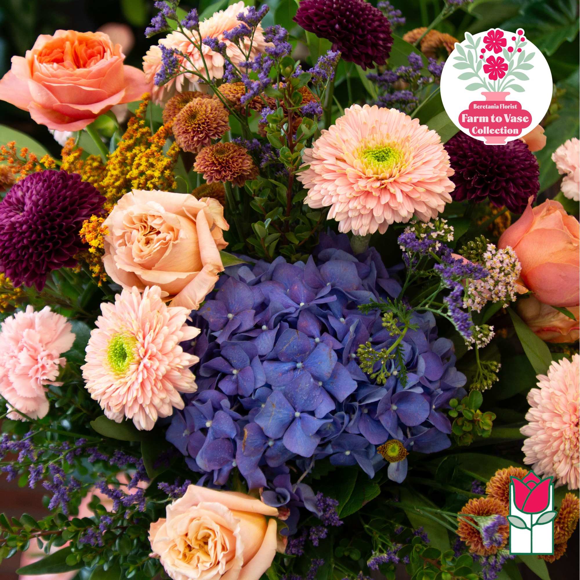 Mixed bouquet with peach roses, purple hydrangea, and pink daisies