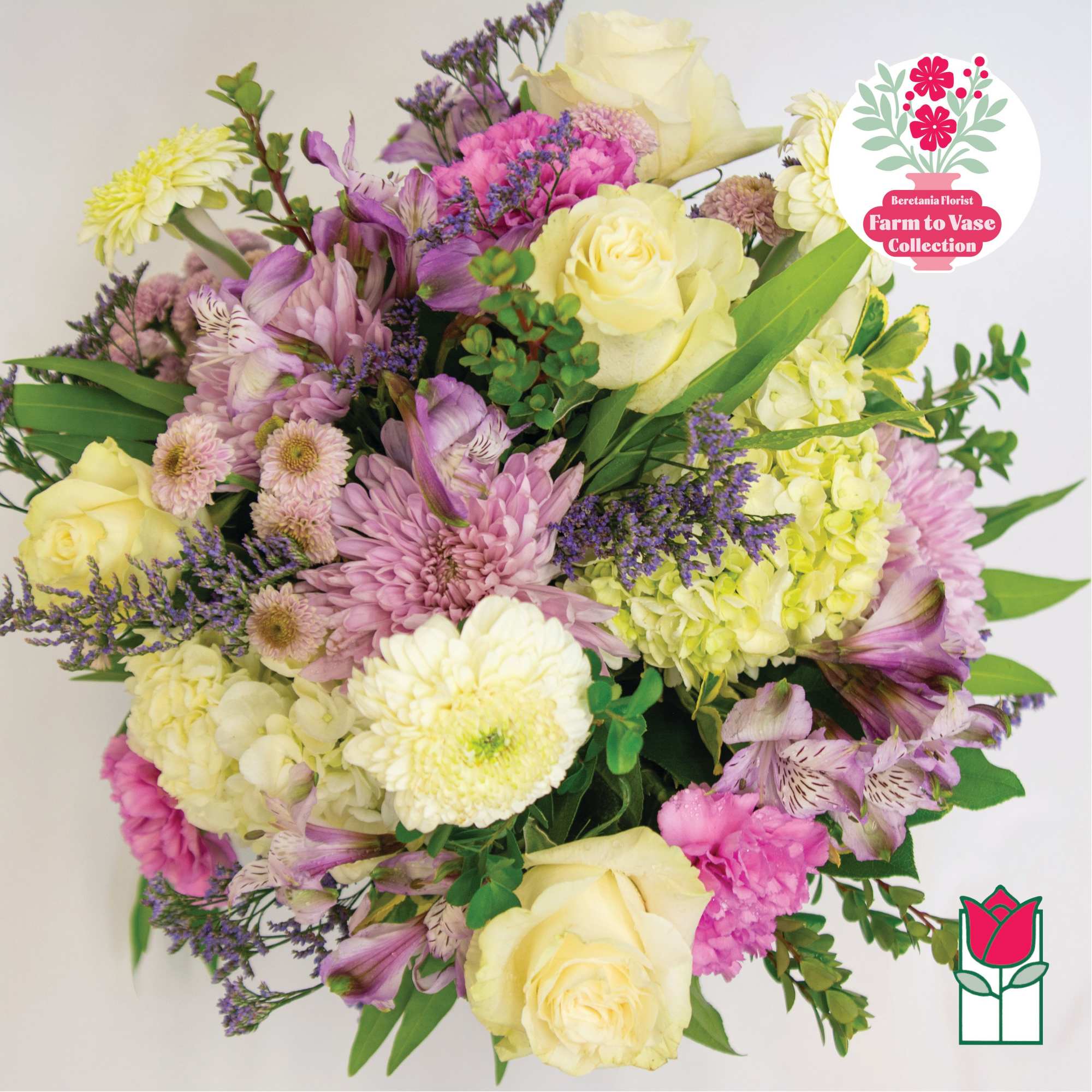 Mixed bouquet of pale yellow roses, lavender flowers, and pink blooms