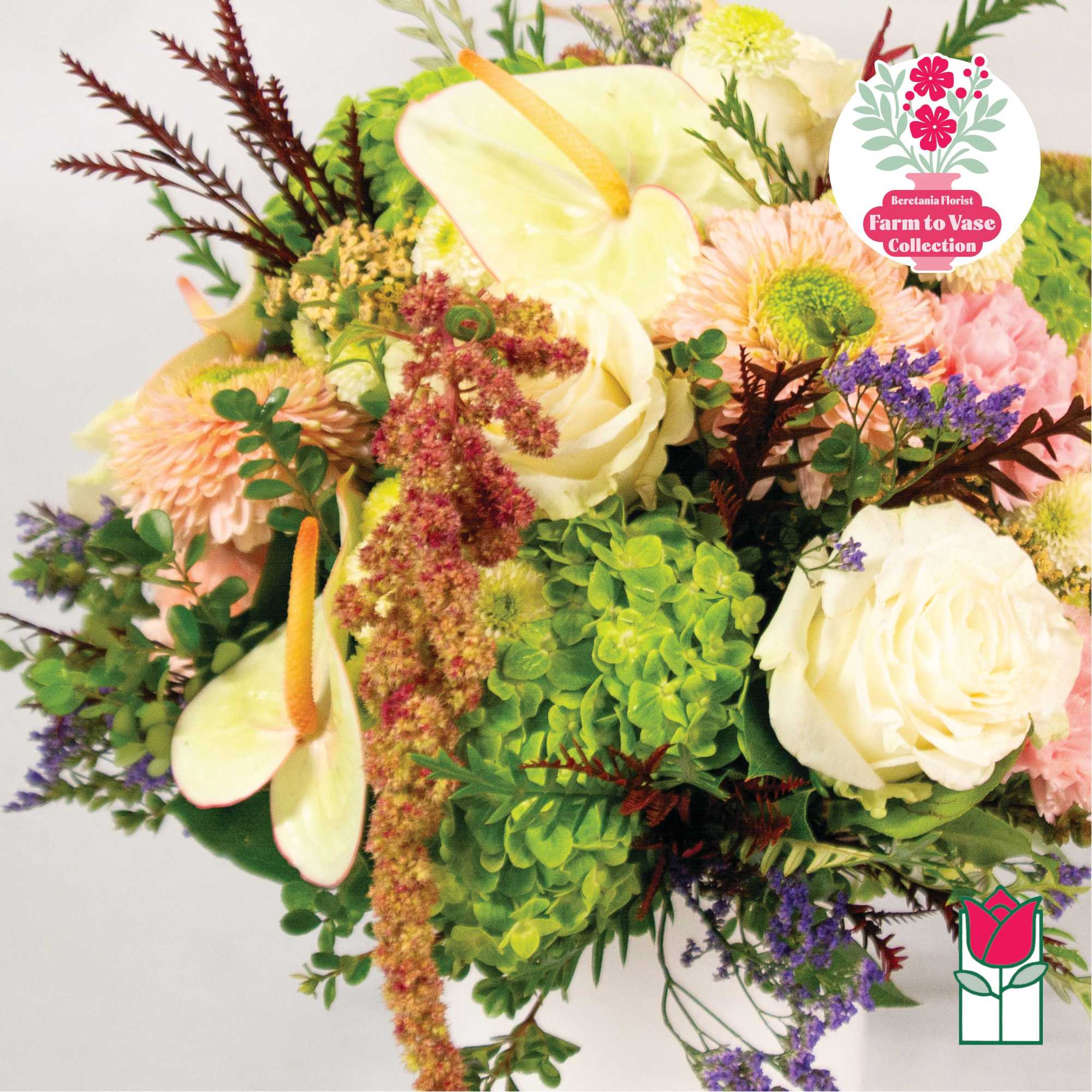 Mixed bouquet with white roses, green hydrangea, and pink flowers