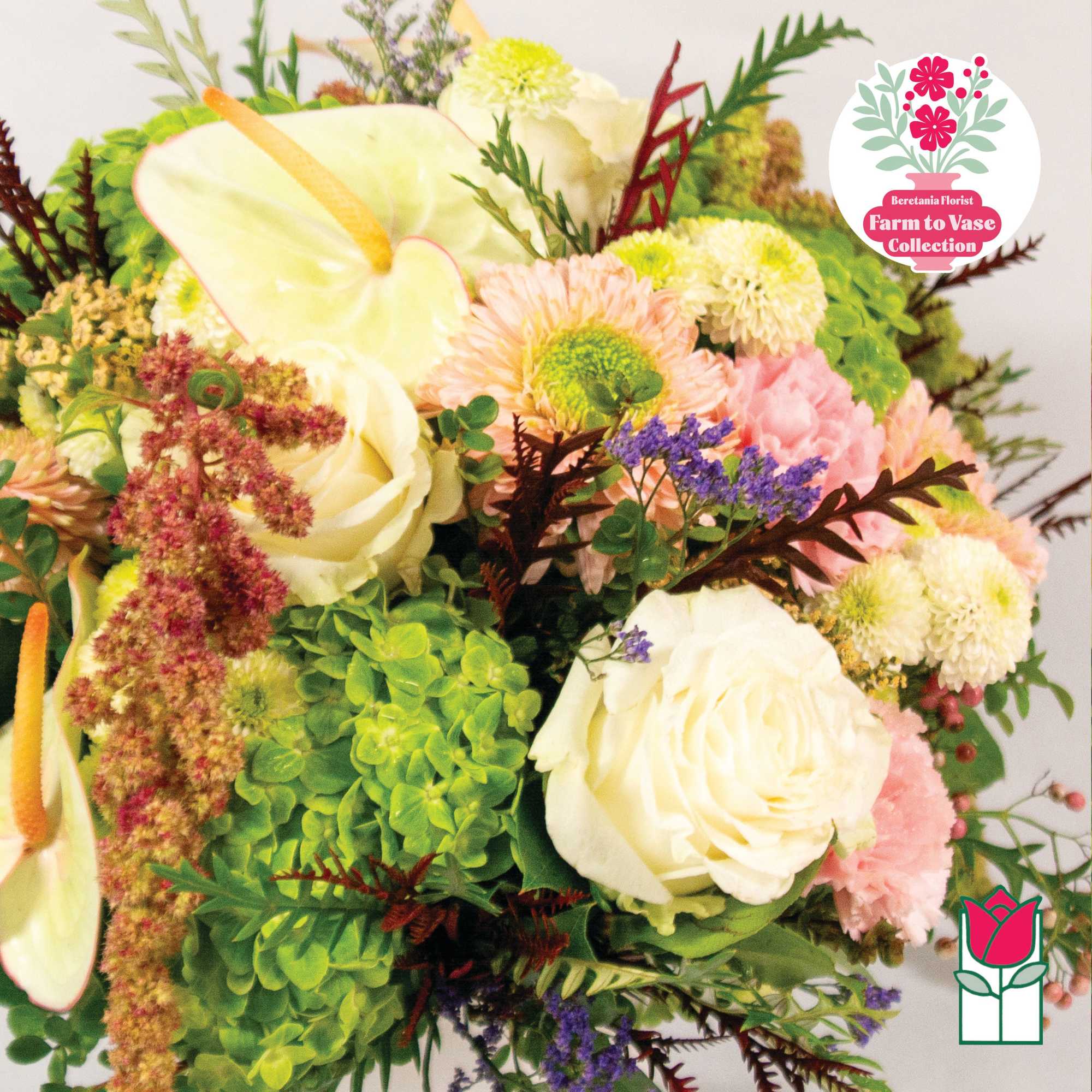 Mixed bouquet with white roses, anthuriums, and pastel blooms
