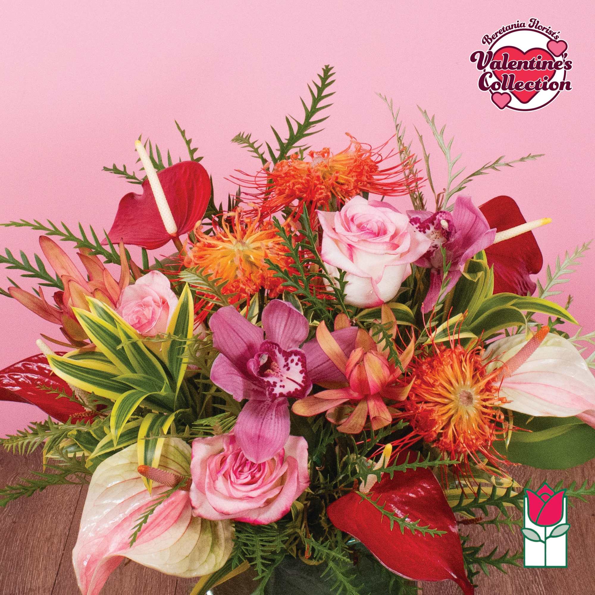 Vase arrangement of pink roses, orchids, red anthuriums, and orange protea on a pink background